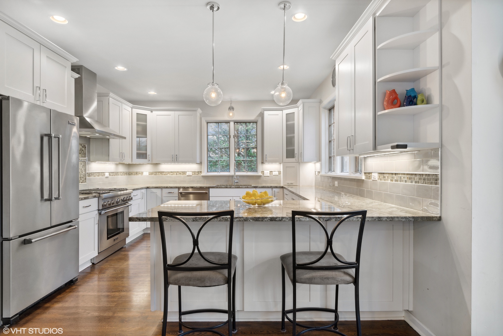 1041 Pontiac Road Wilmette, IL 60091 - Photo 6 of 33 a kitchen with stainless steel appliances a dining table chairs stove refrigerator and cabinets