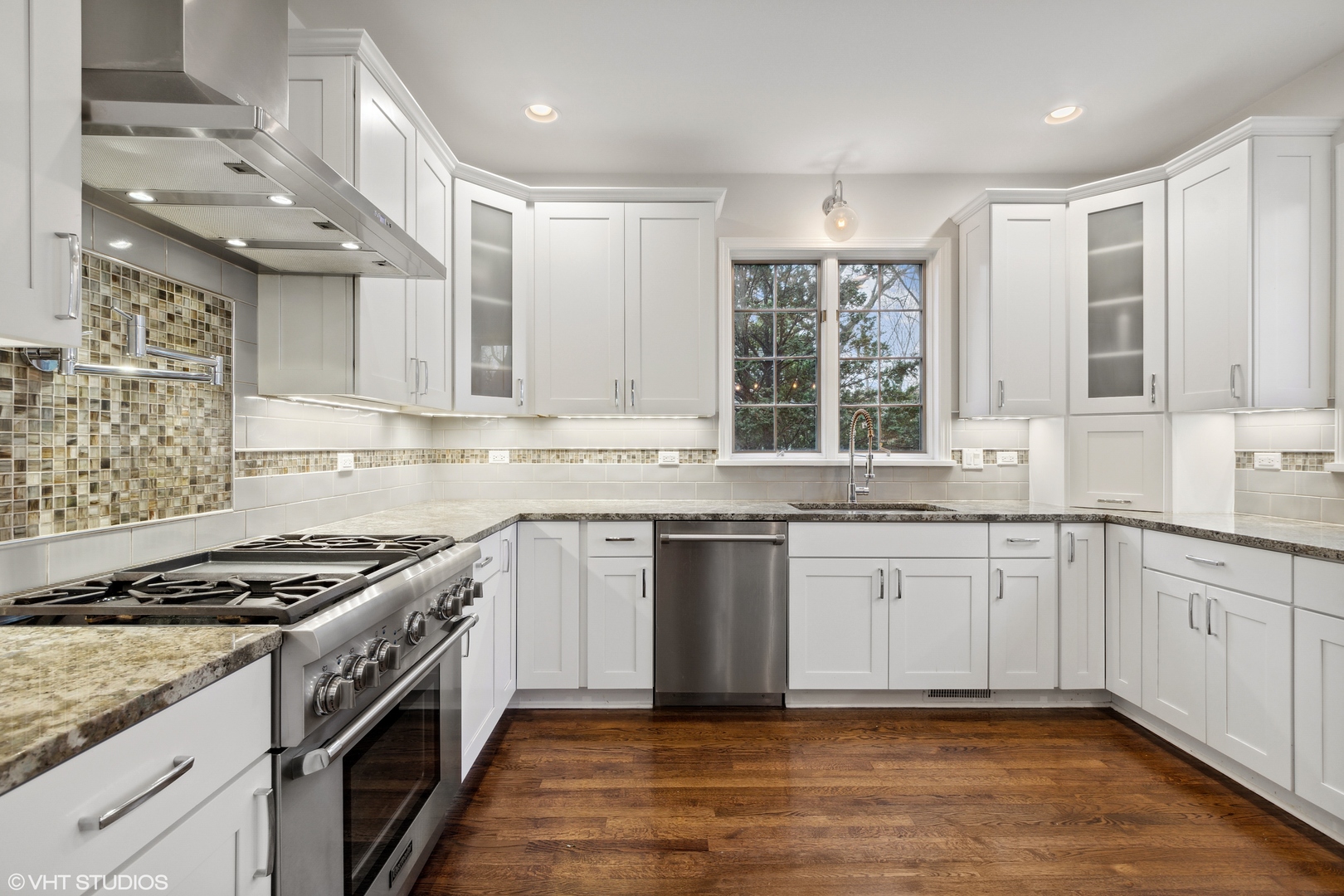 1041 Pontiac Road Wilmette, IL 60091 - Photo 8 of 33 a kitchen with granite countertop cabinets stainless steel appliances a sink and a window