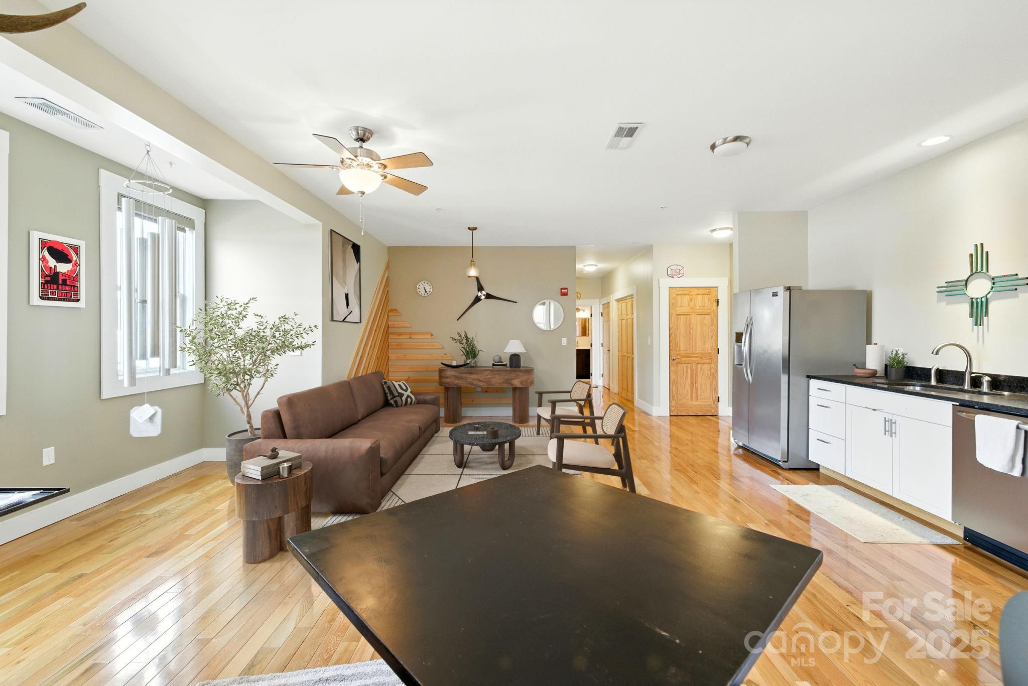 23 South Broad Street Brevard, NC 28712 - Photo 11 of 30 a living room with furniture and kitchen view