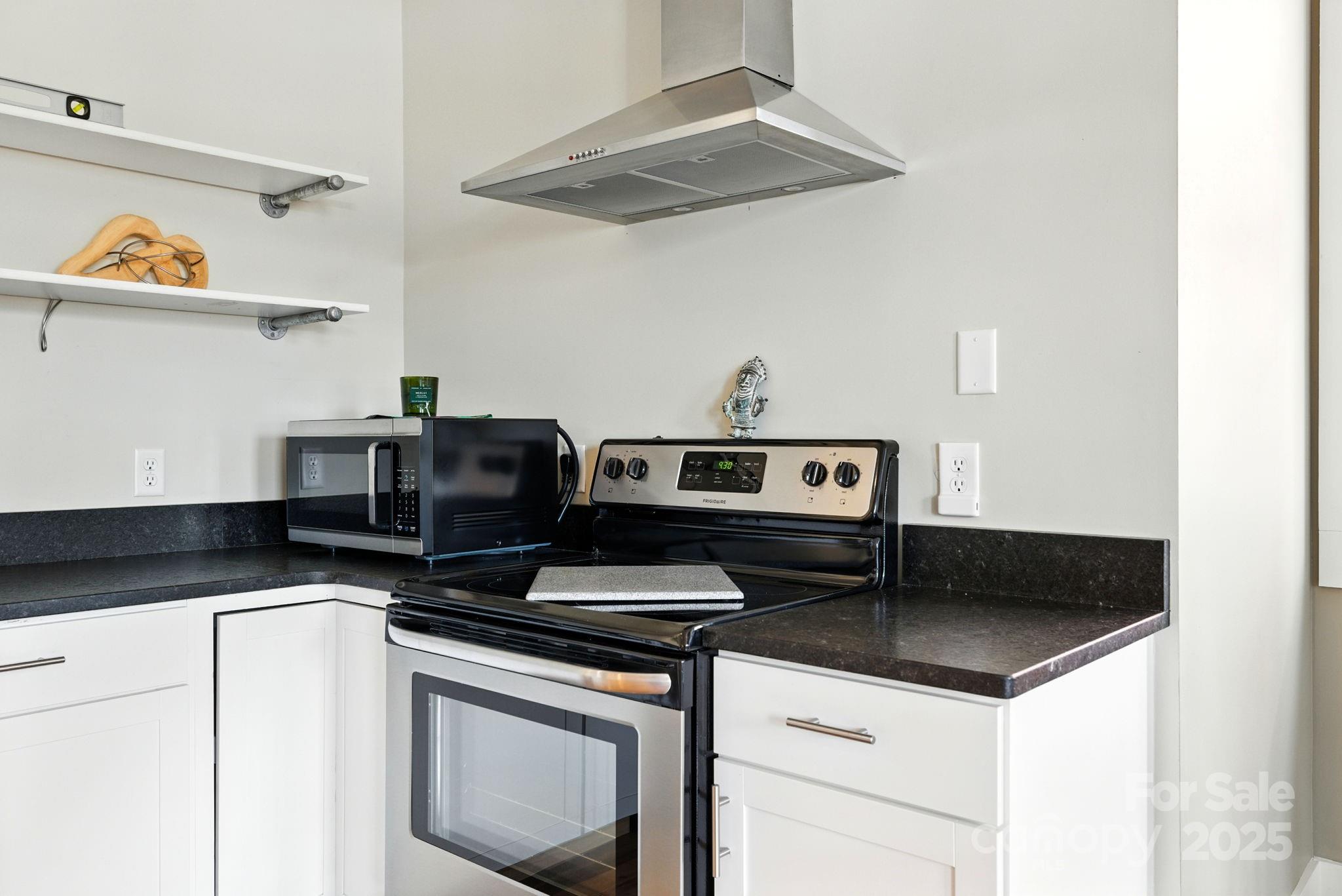 23 South Broad Street Brevard, NC 28712 - Photo 16 of 30 a kitchen with a stove cabinets and counter space
