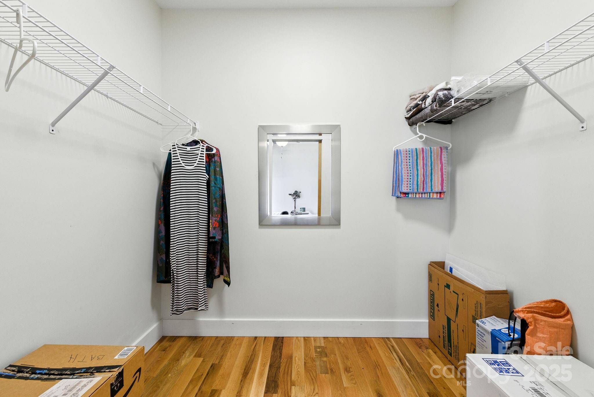 23 South Broad Street Brevard, NC 28712 - Photo 23 of 30 a view of a room with wooden floor and ceiling fan