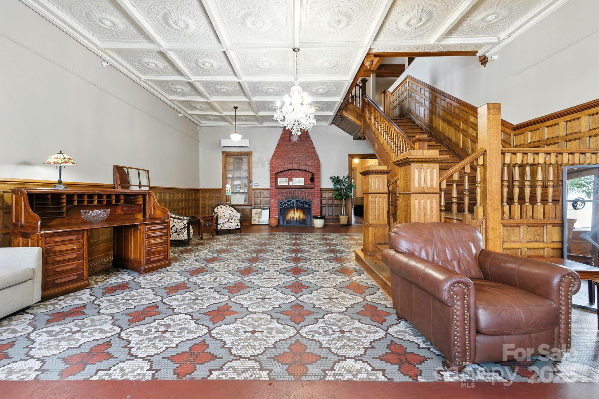23 South Broad Street Brevard, NC 28712 - Photo 3 of 30 a living room with furniture a flat screen tv and couches