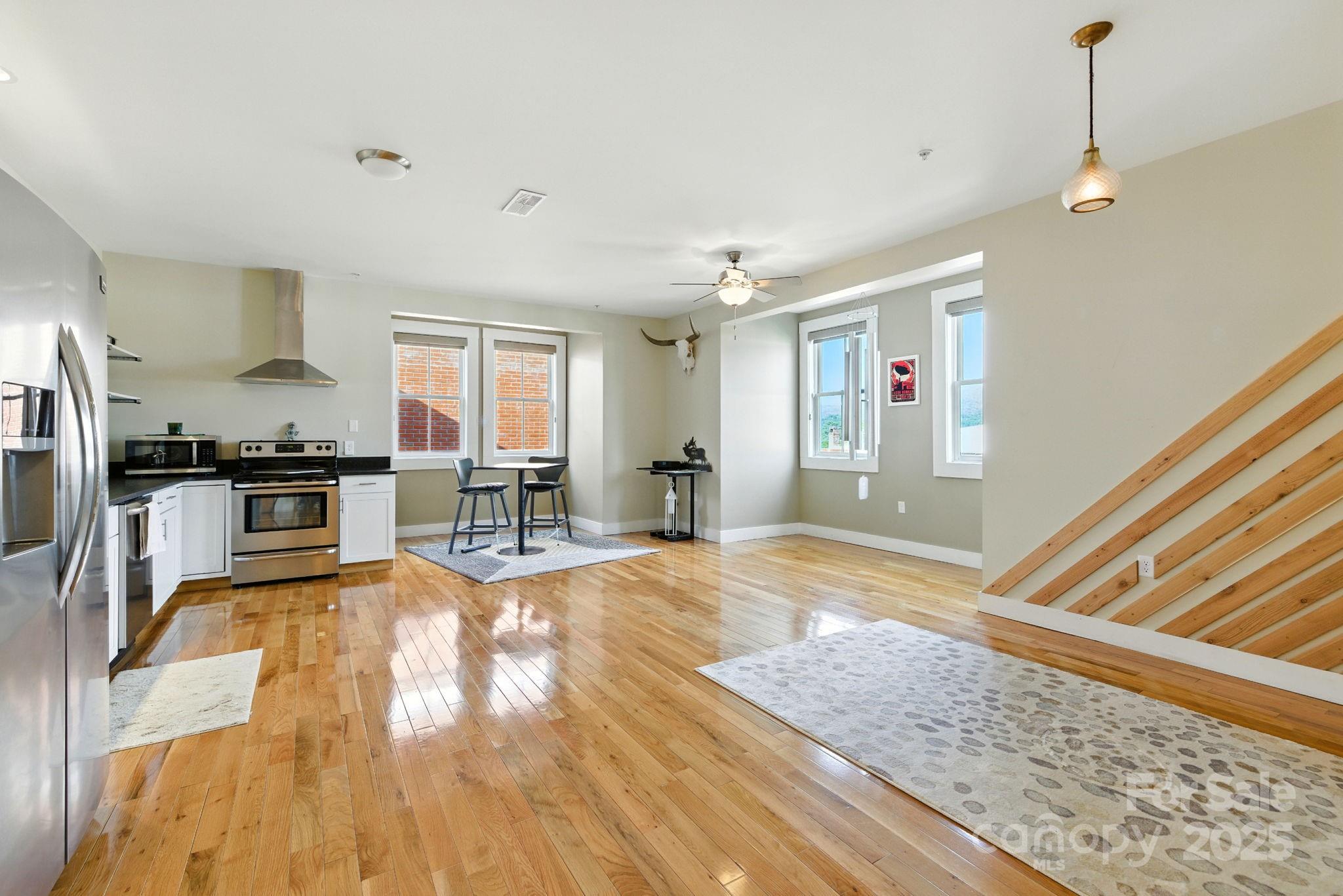 23 South Broad Street Brevard, NC 28712 - Photo 4 of 30 a view of kitchen with sink microwave and stove