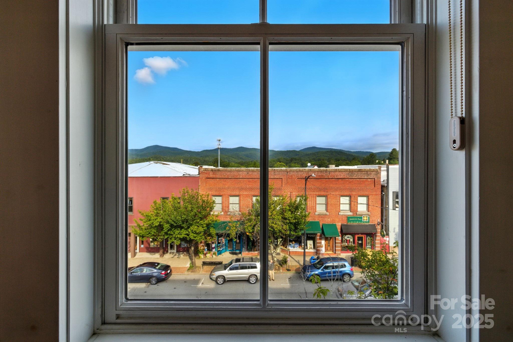 23 South Broad Street Brevard, NC 28712 - Photo 5 of 30 a view of a room with a large window and front door