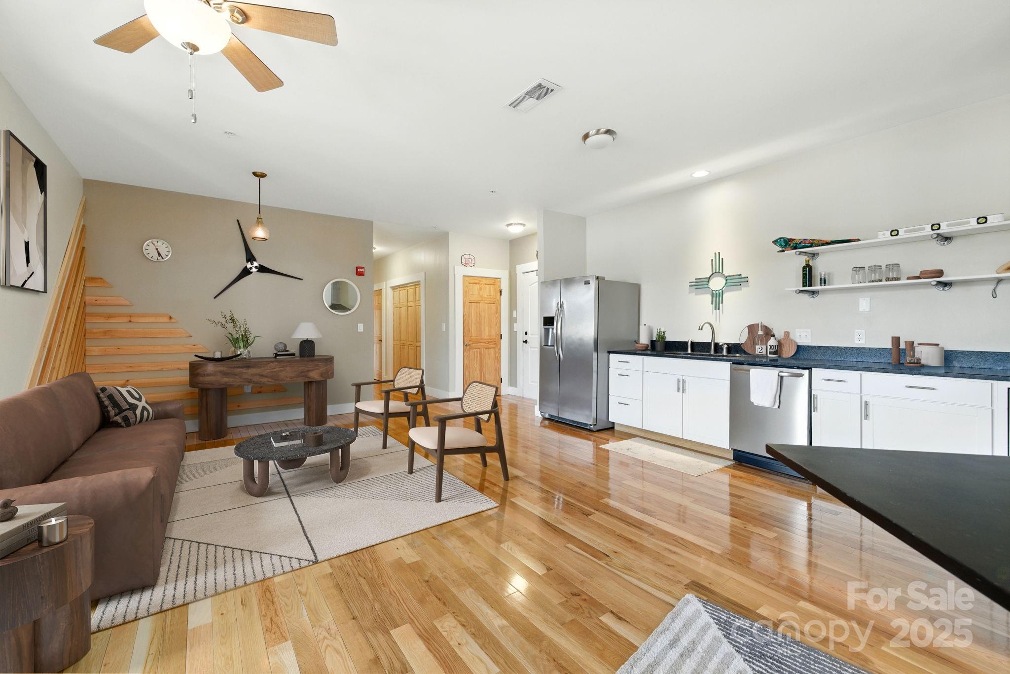 23 South Broad Street Brevard, NC 28712 - Photo 9 of 30 a living room with furniture and kitchen view