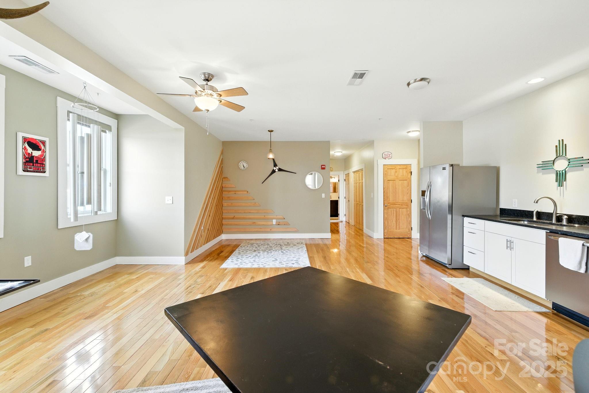 23 South Broad Street Brevard, NC 28712 - Photo 10 of 30 a view of a living room a chandelier