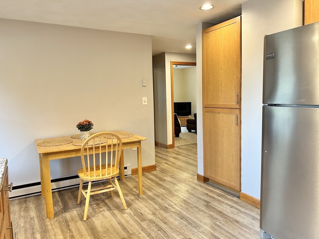 13 Princeton Street, Unit 2 Somerville, MA 02144 - Photo 3 of 9 a dining room with furniture a wooden floor and a sink