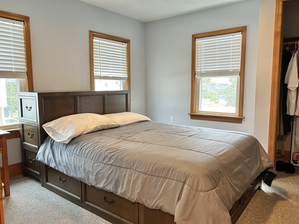 13 Princeton Street, Unit 2 Somerville, MA 02144 - Photo 6 of 9 a bedroom with a bed and window