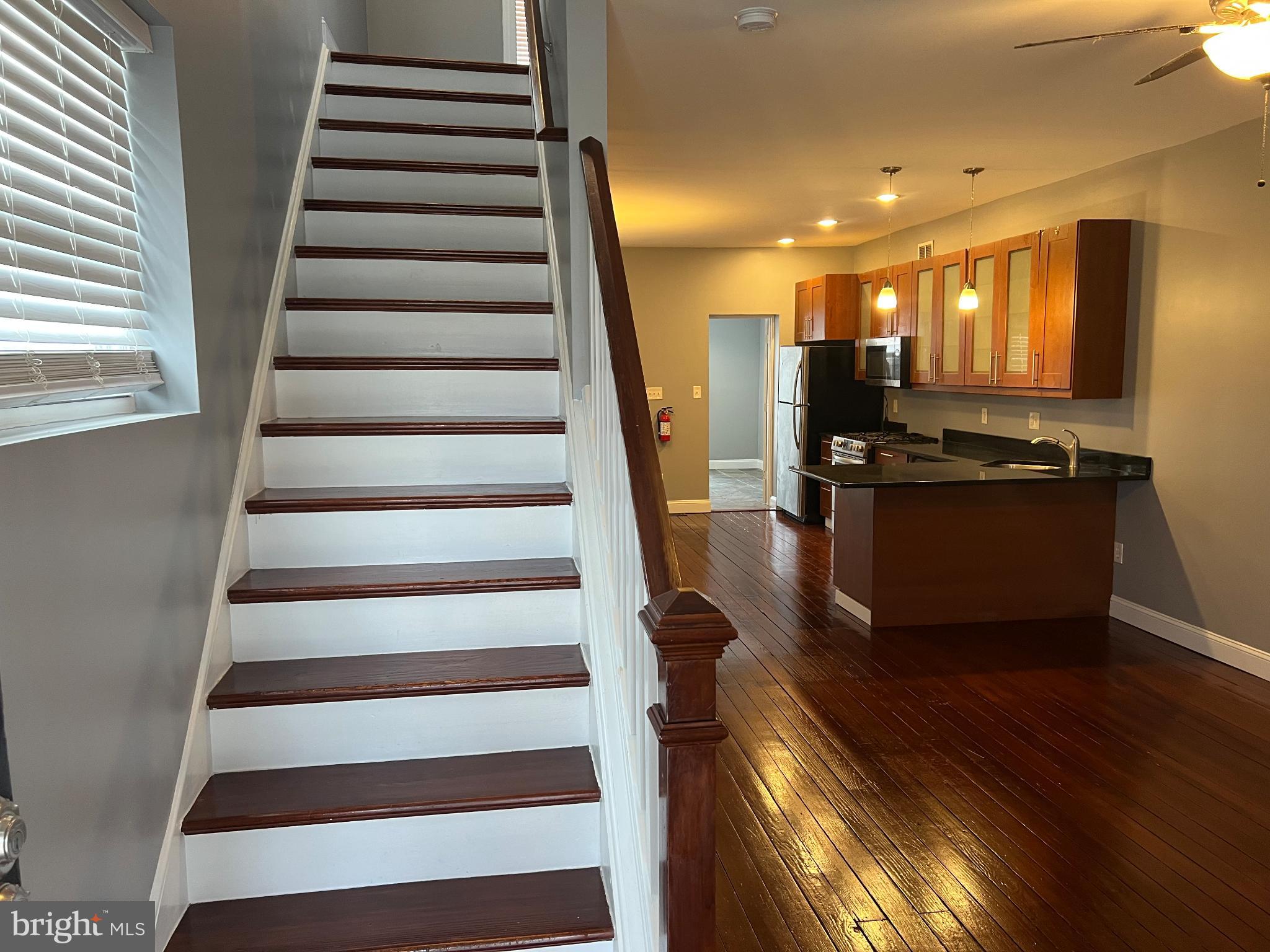 102 3rd Avenue Roebling, NJ 08554 - Photo 4 of 8 a view of a living room with wooden floor and furniture
