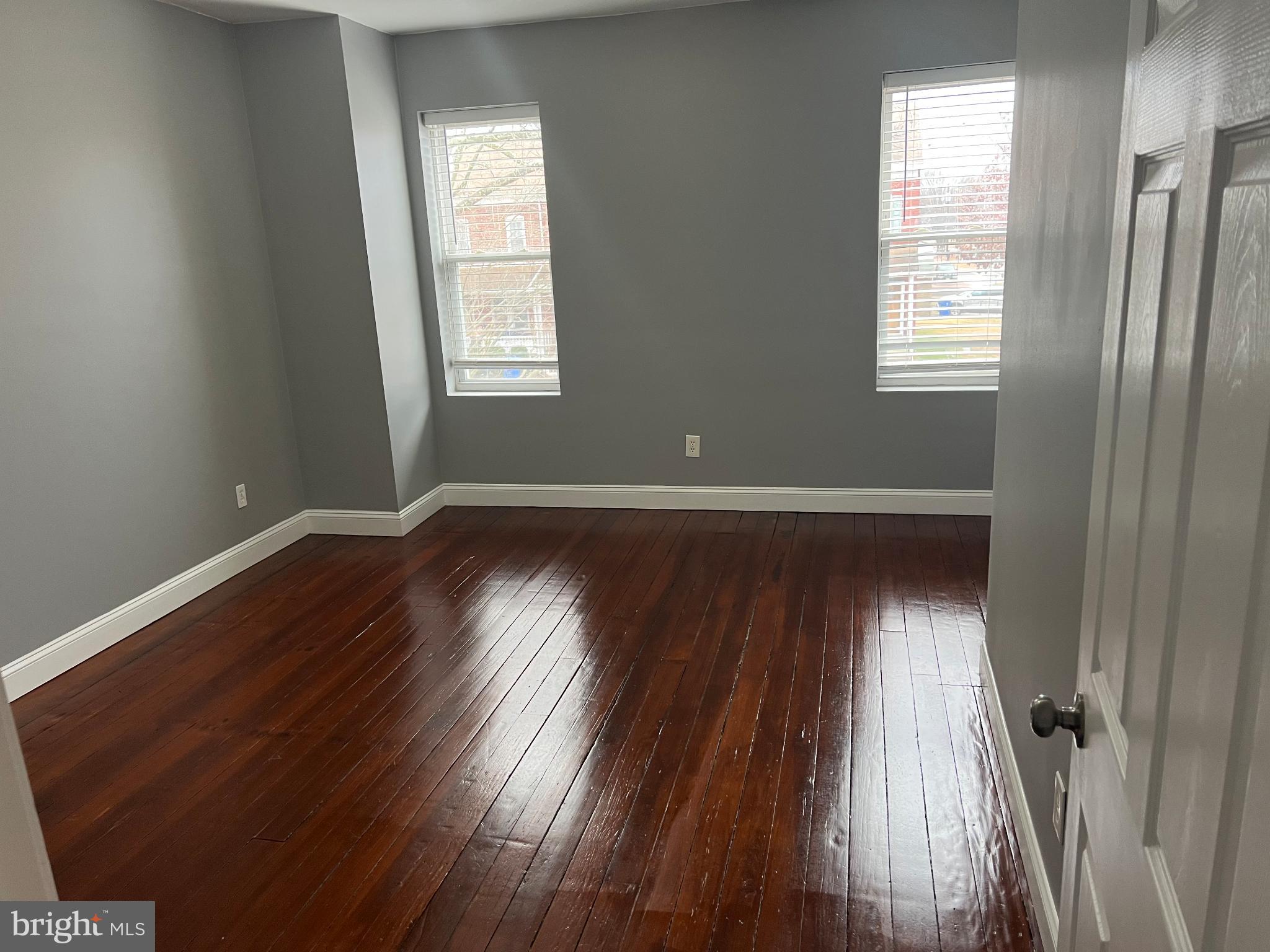 102 3rd Avenue Roebling, NJ 08554 - Photo 6 of 8 an empty room with wooden floor and windows