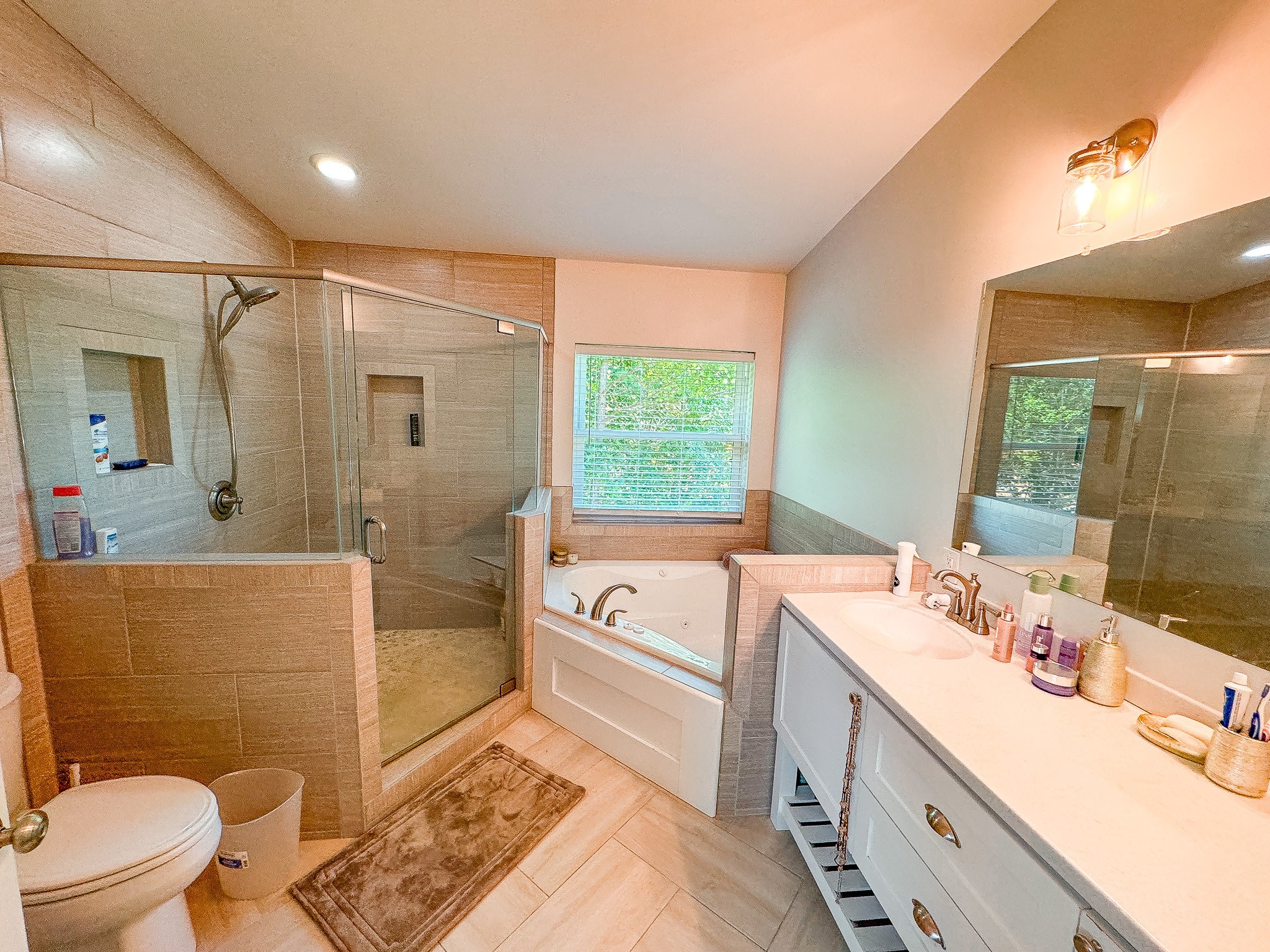 4042 Jones Hollow Road Lobelville, TN 37097 - Photo 12 of 30 a bathroom with a sink a toilet a mirror and shower