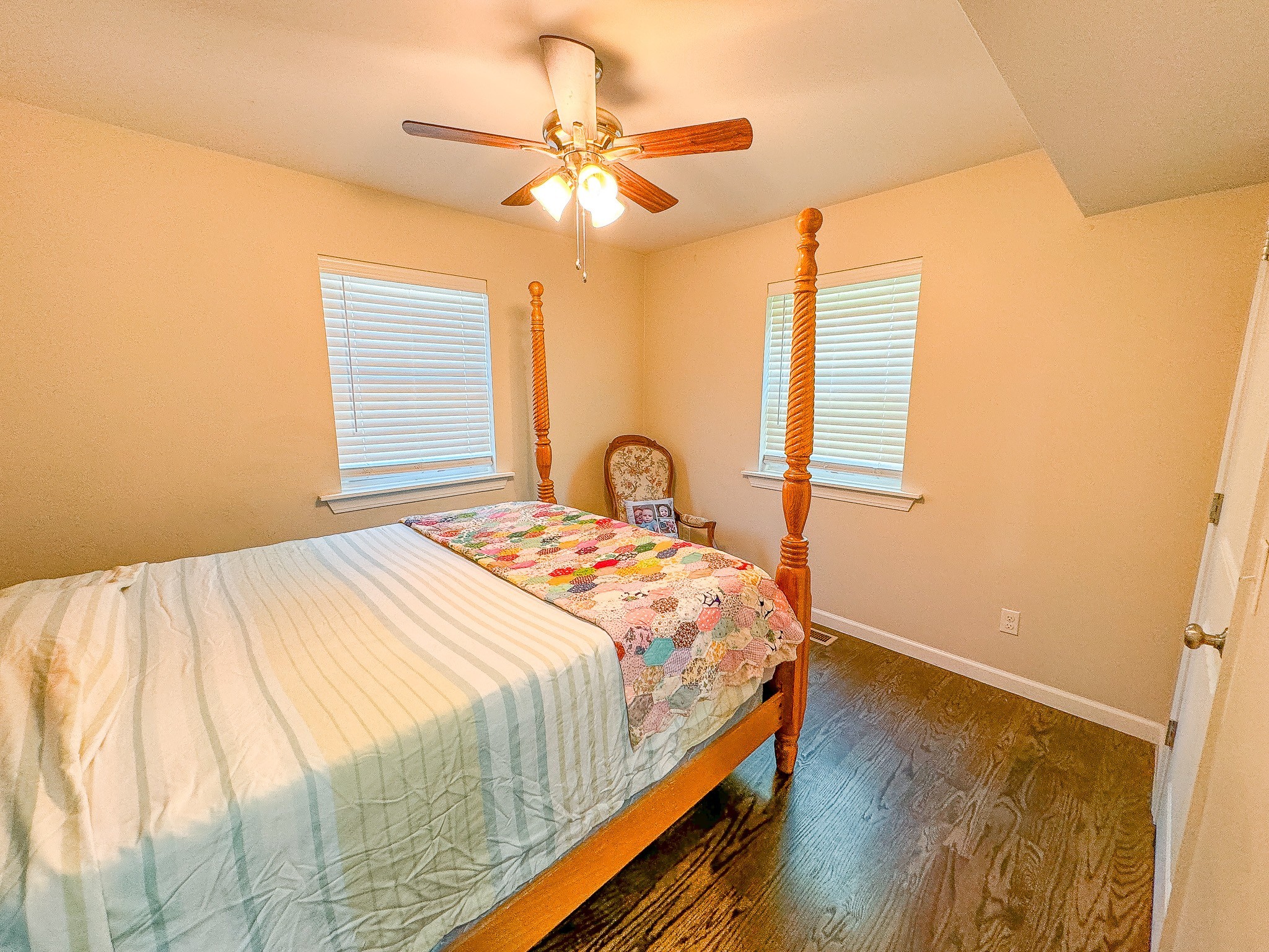 4042 Jones Hollow Road Lobelville, TN 37097 - Photo 15 of 30 a bedroom with a bed and a window