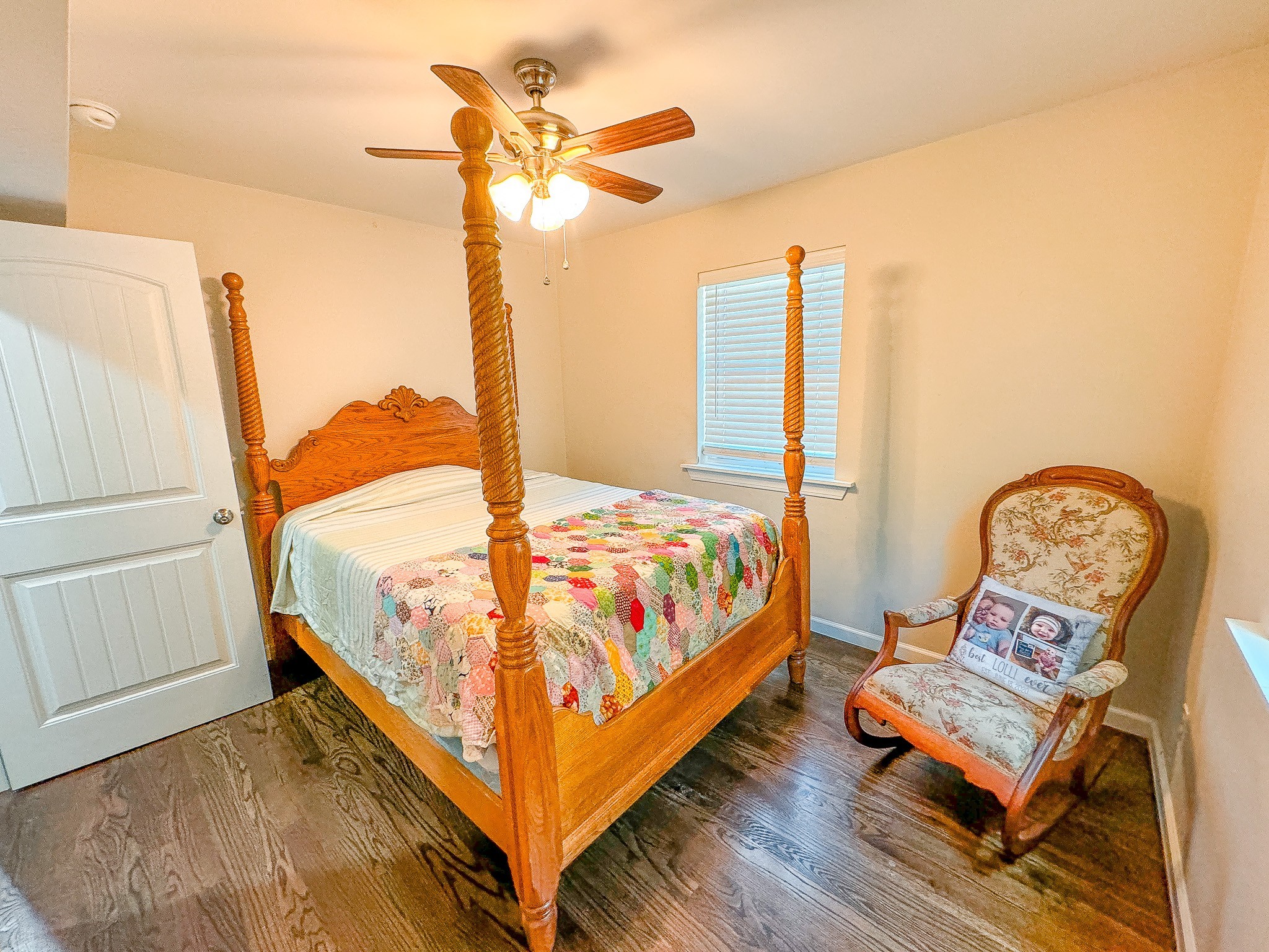 4042 Jones Hollow Road Lobelville, TN 37097 - Photo 16 of 30 a bedroom with a bed a window and painting on the wall