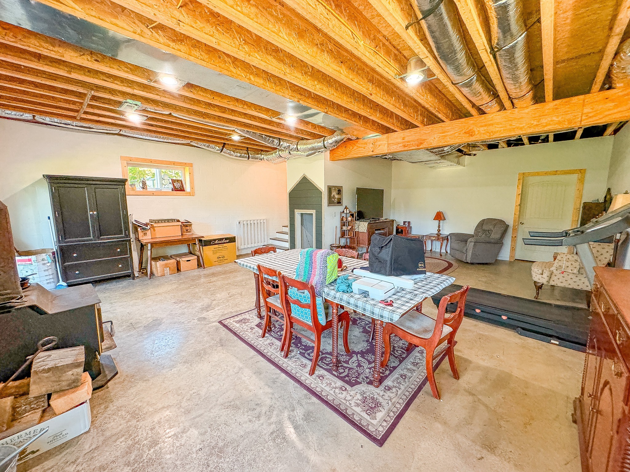 4042 Jones Hollow Road Lobelville, TN 37097 - Photo 23 of 30 a living room with furniture and a table