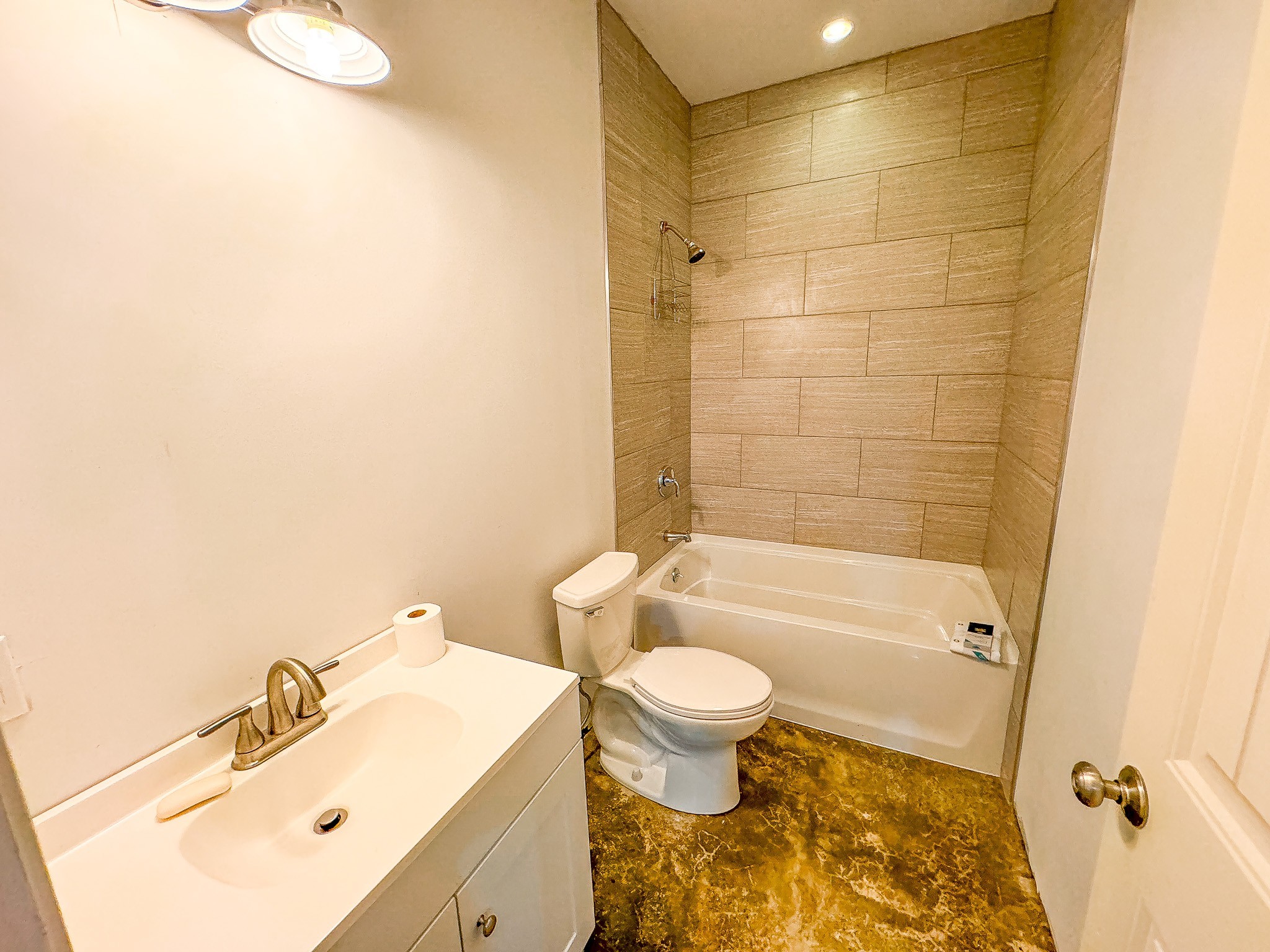 4042 Jones Hollow Road Lobelville, TN 37097 - Photo 25 of 30 a bathroom with a sink mirror toilet and bathtub