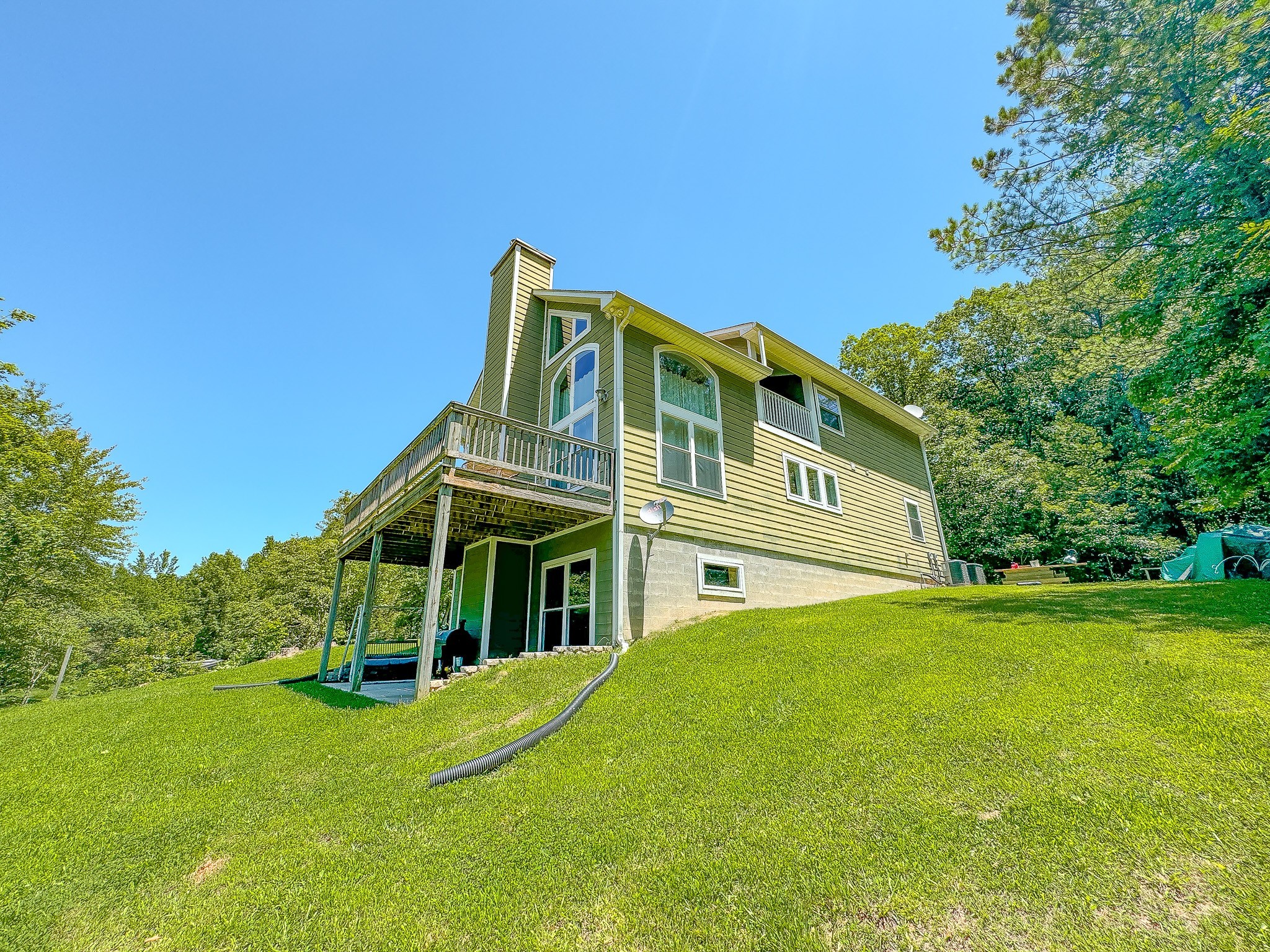 4042 Jones Hollow Road Lobelville, TN 37097 - Photo 26 of 30 a front view of a house with a garden