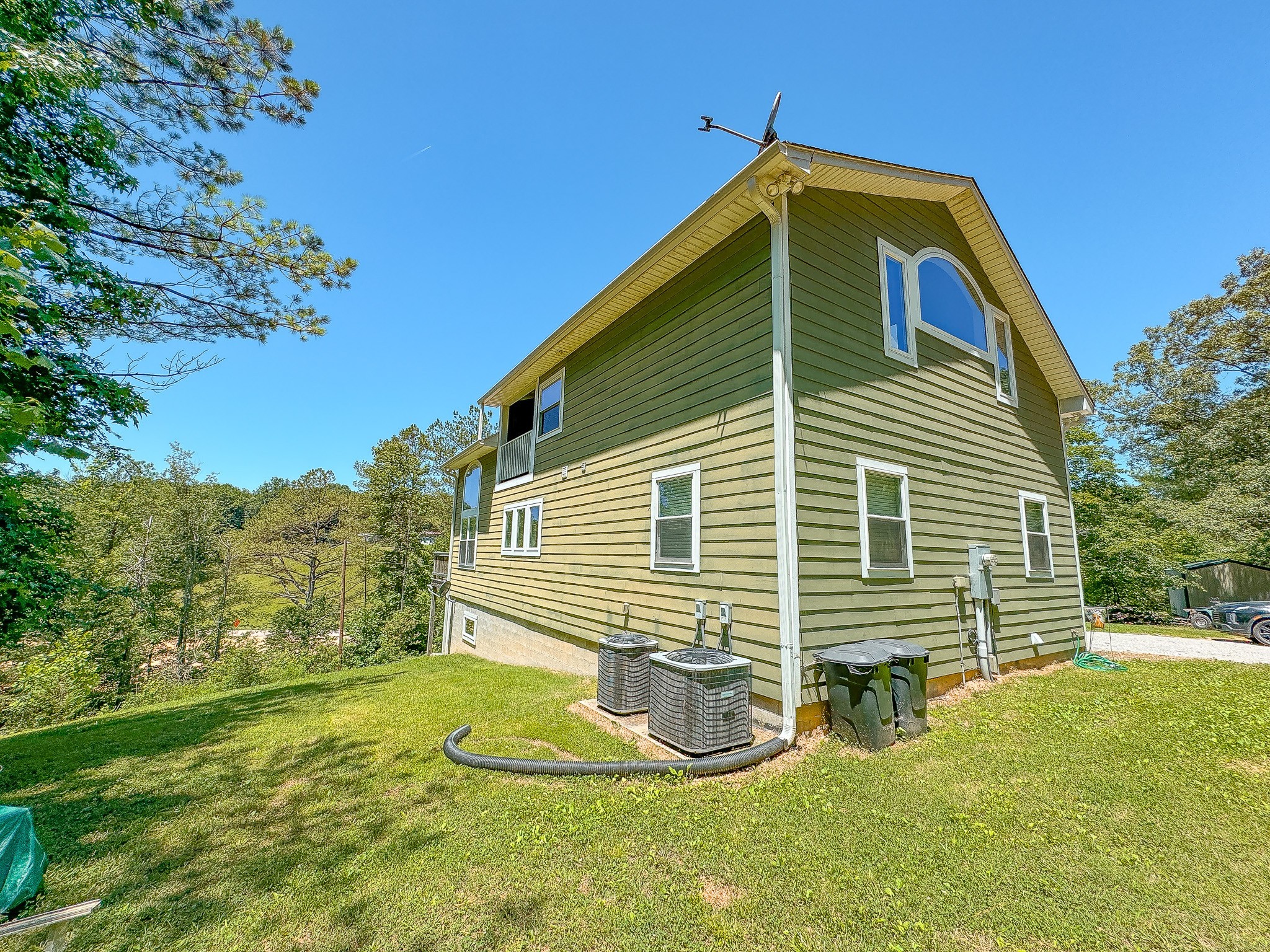 4042 Jones Hollow Road Lobelville, TN 37097 - Photo 28 of 30 a front view of a house with garden