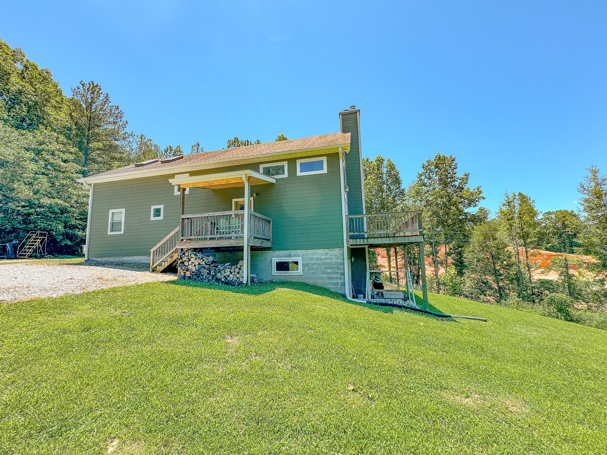 4042 Jones Hollow Road Lobelville, TN 37097 - Photo 29 of 30 a view of a house with backyard and garden
