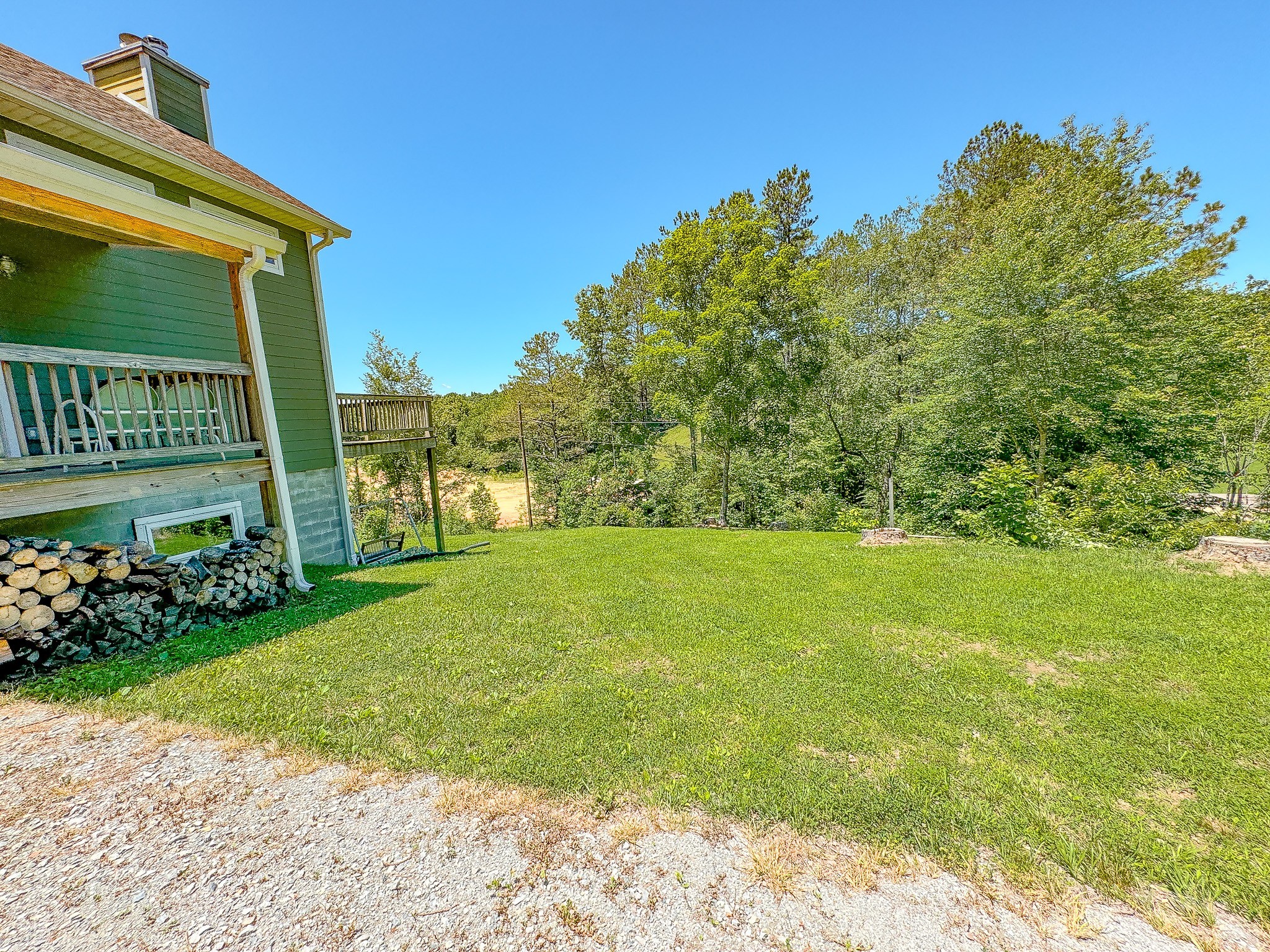 4042 Jones Hollow Road Lobelville, TN 37097 - Photo 30 of 30 a view of a garden with a building in the background