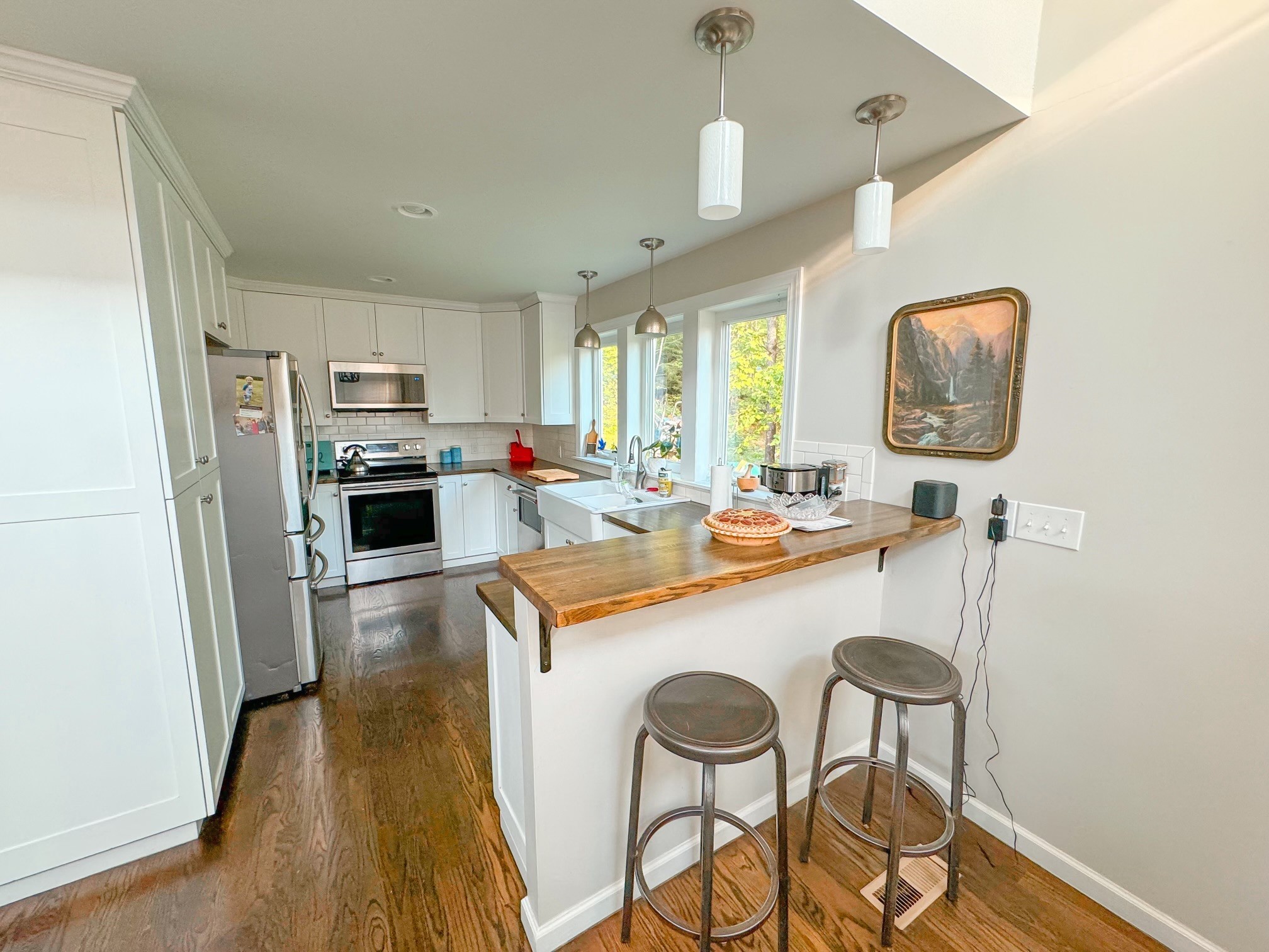 4042 Jones Hollow Road Lobelville, TN 37097 - Photo 4 of 30 a kitchen with a sink a stove a refrigerator and a refrigerator