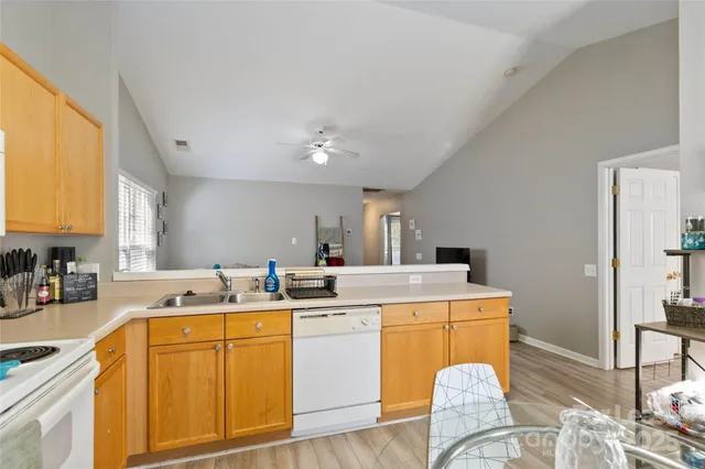 a room with sink washer and dryer