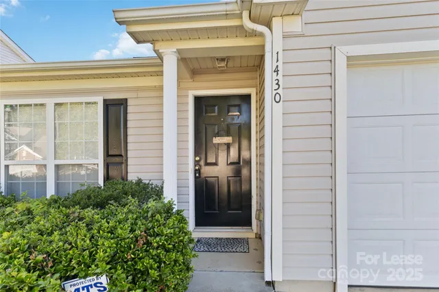 view of front door and small yard