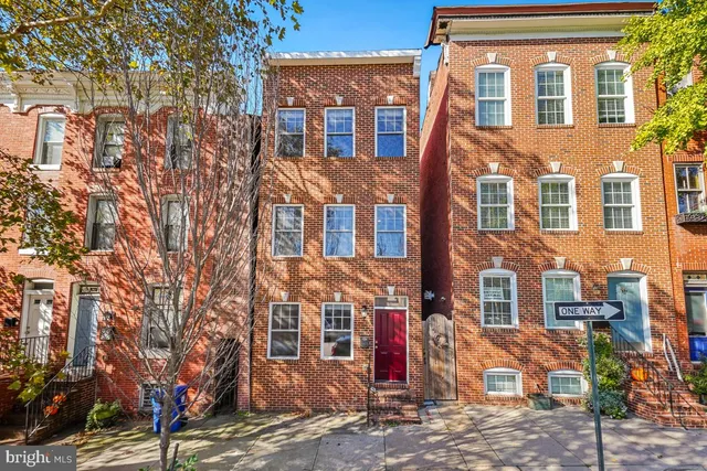 a front view of a multi story residential apartment building