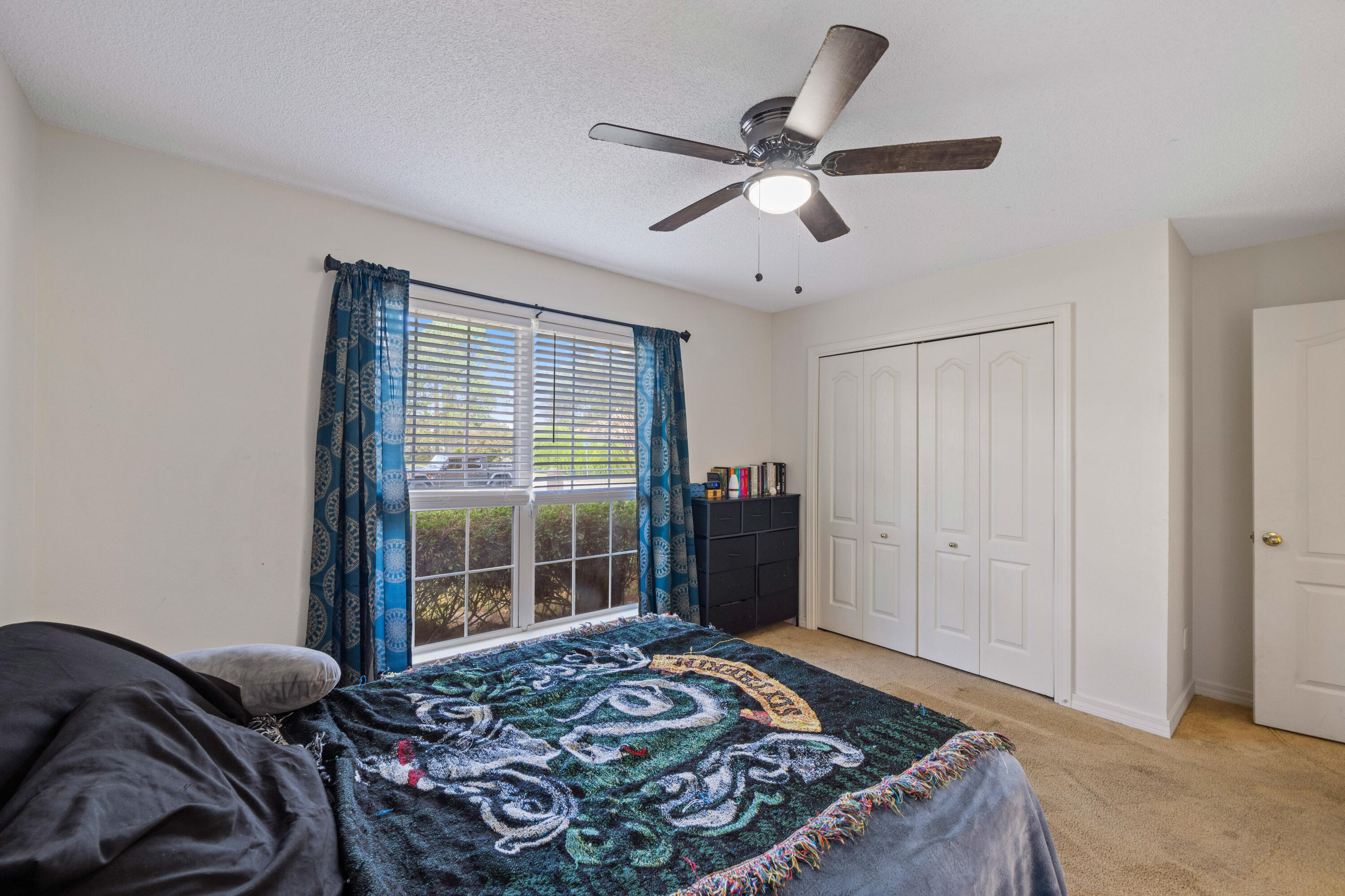 7199 Riverview Road Navarre, FL 32566 - Photo 13 of 15 a bedroom with a bed and window