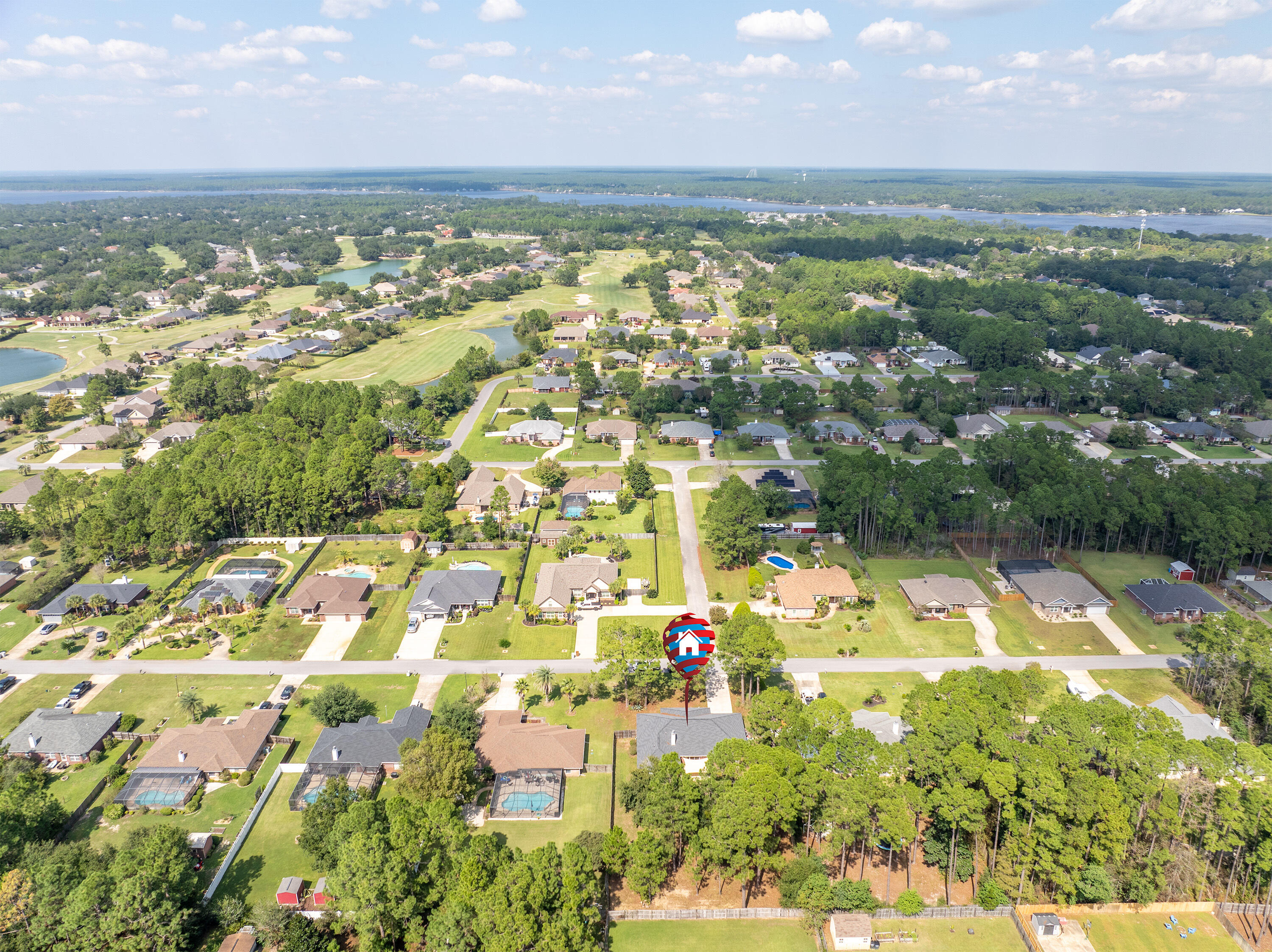7199 Riverview Road Navarre, FL 32566 - Photo 3 of 15 an aerial view of residential houses with outdoor space and trees