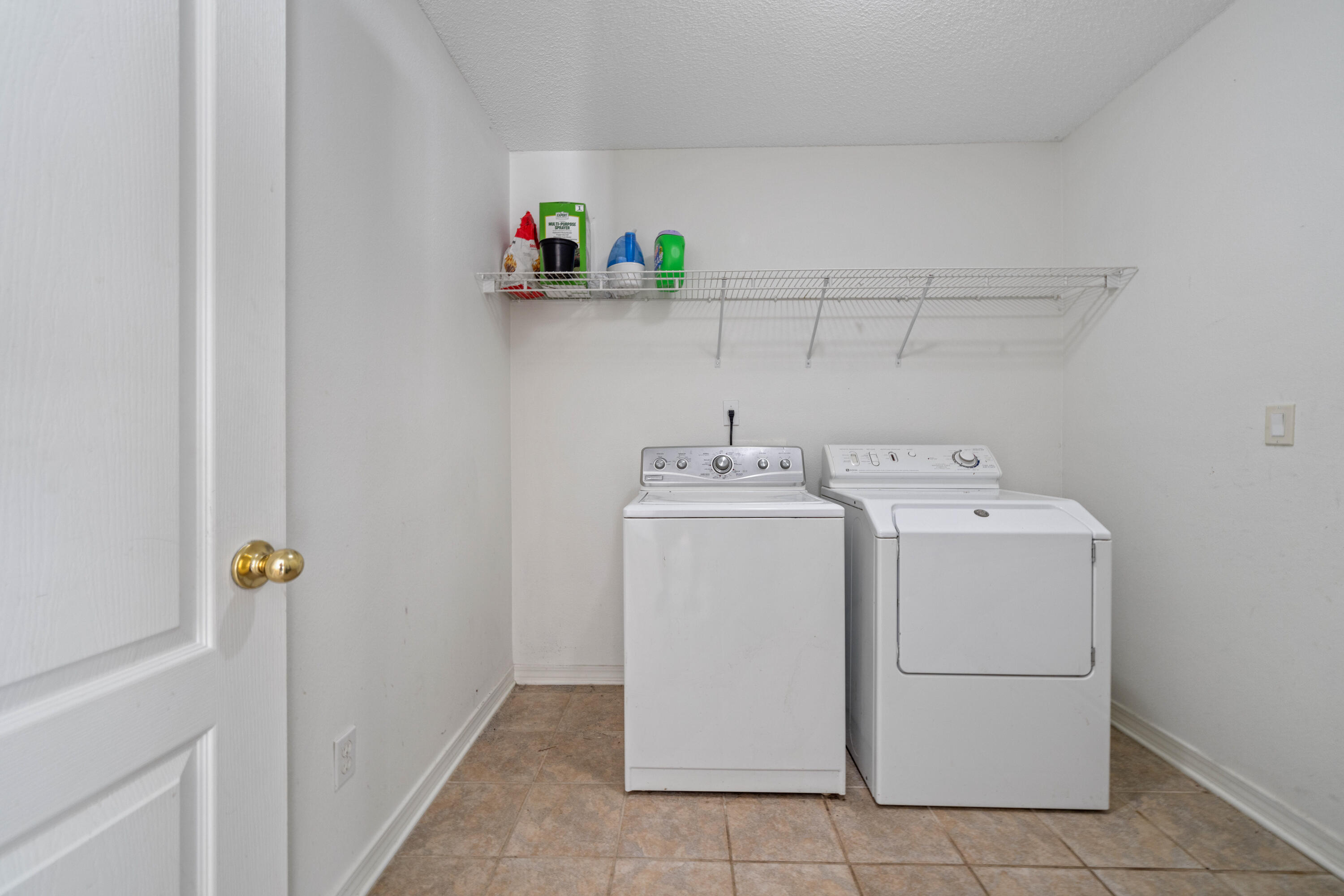 7199 Riverview Road Navarre, FL 32566 - Photo 8 of 15 a utility room with dryer and washer