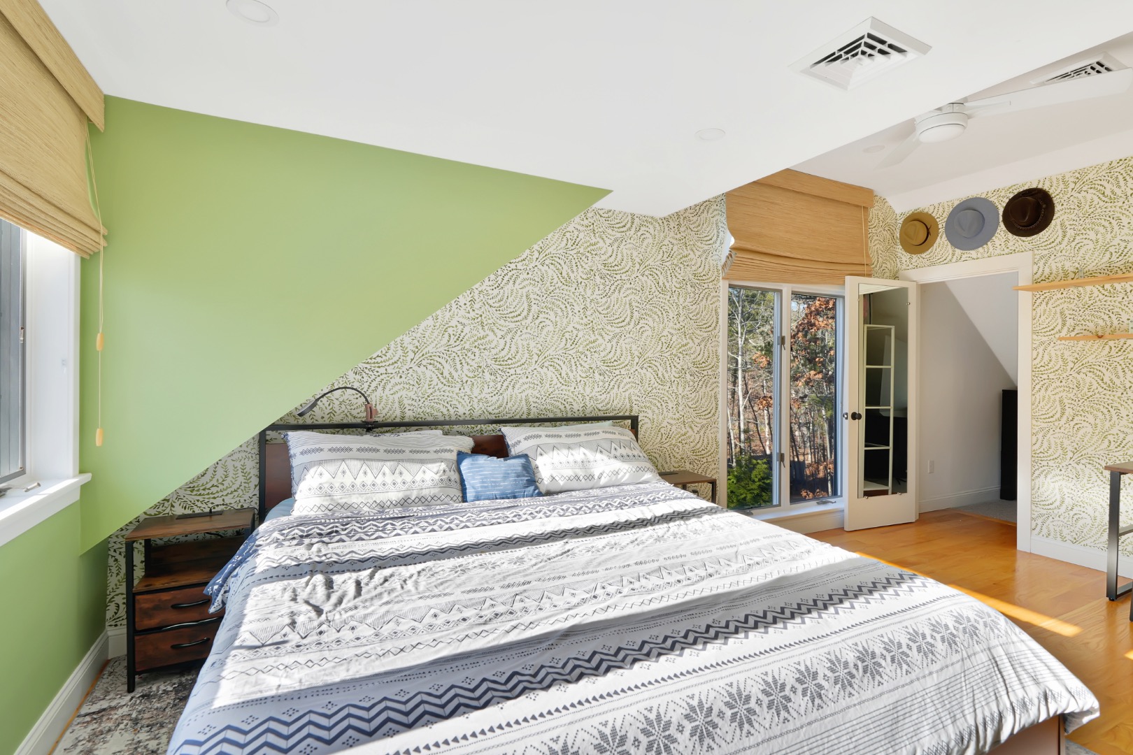 7 Meetinghouse Village Way Edgartown, MA 02539 - Photo 17 of 27 a bedroom with a bed and a large window