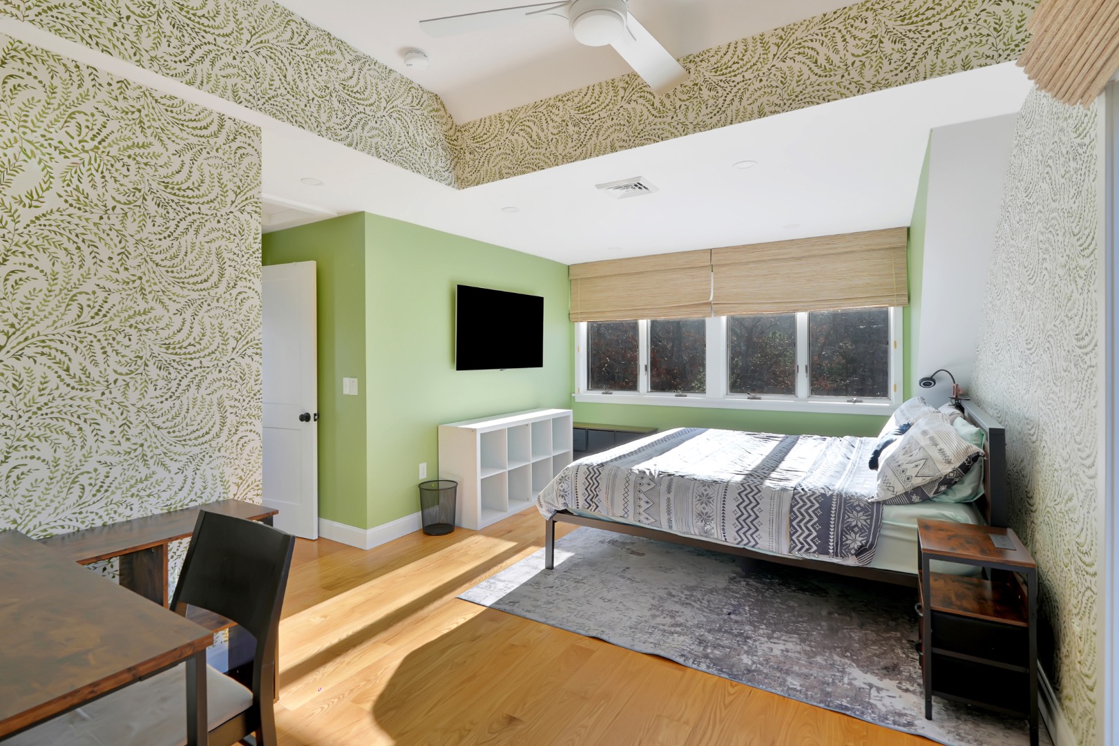 7 Meetinghouse Village Way Edgartown, MA 02539 - Photo 18 of 27 a bedroom with furniture and a flat screen tv