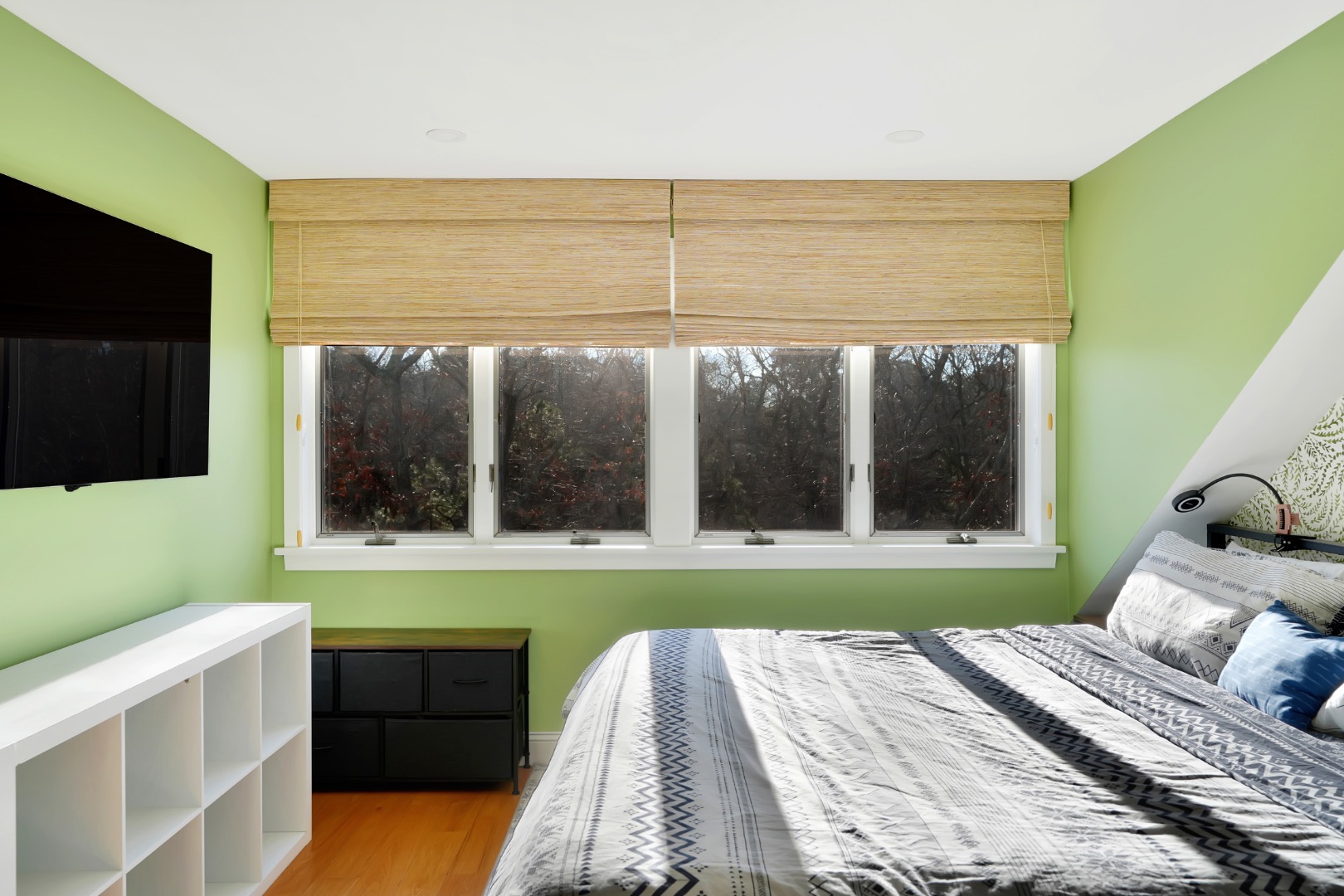 7 Meetinghouse Village Way Edgartown, MA 02539 - Photo 19 of 27 a bedroom with a bed and a flat tv screen on the dresser