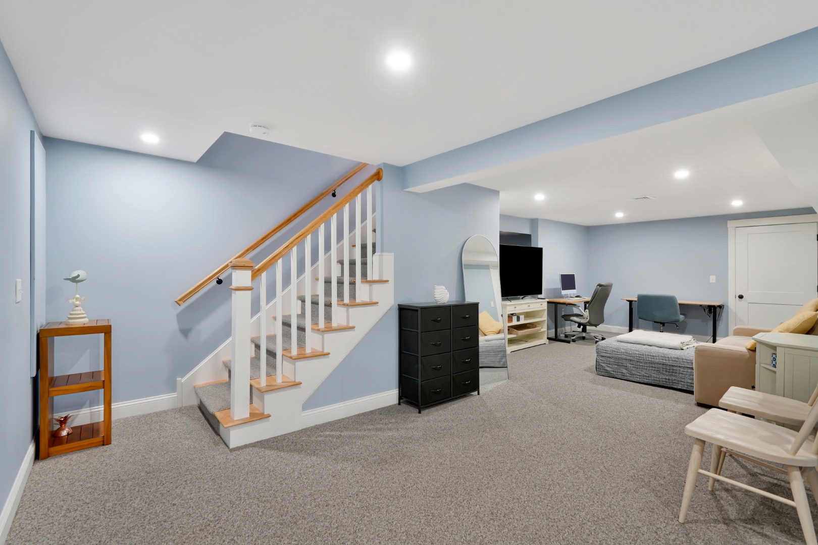 7 Meetinghouse Village Way Edgartown, MA 02539 - Photo 21 of 27 a living room with furniture and stairs