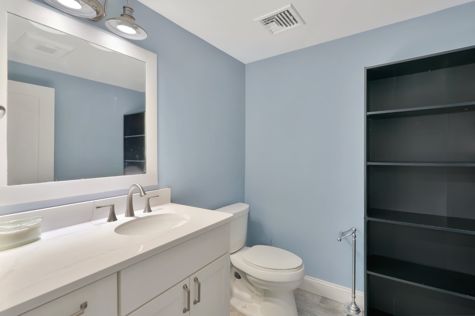 7 Meetinghouse Village Way Edgartown, MA 02539 - Photo 24 of 27 a bathroom with a sink a toilet and a mirror