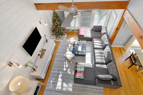 a view of a house with backyard and sitting area