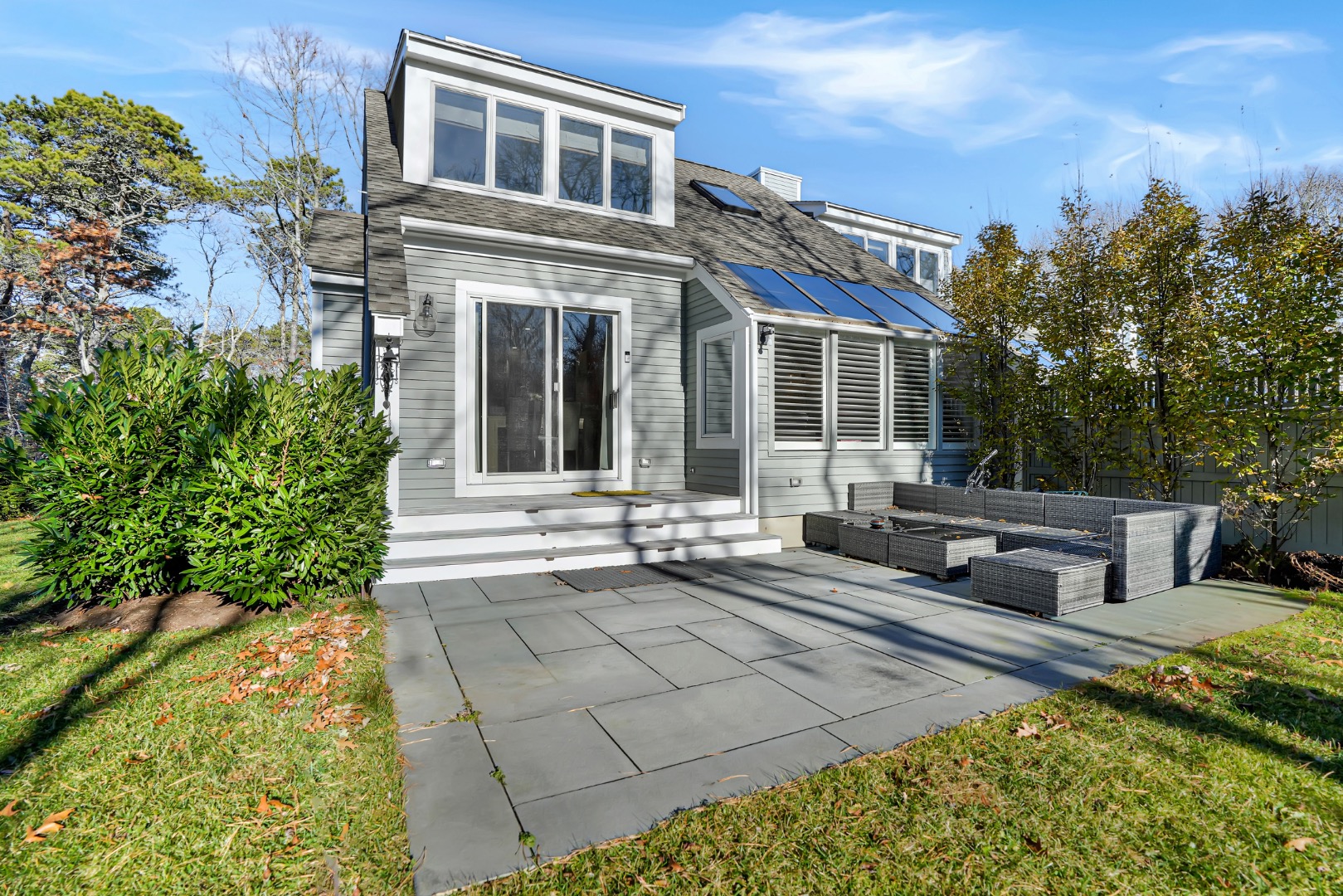 7 Meetinghouse Village Way Edgartown, MA 02539 - Photo 26 of 27 a view of a house with backyard and sitting area