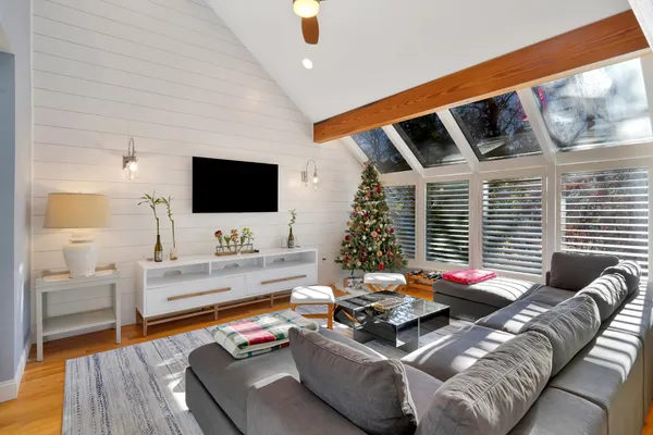 a living room with furniture and a flat screen tv