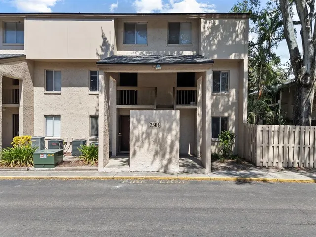 a view of a house with a parking area