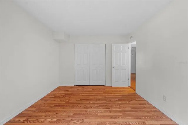 a view of a room with a wooden floor