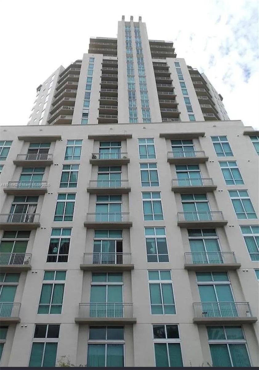 9066 Southwest 73rd Court, Unit 2101 Miami, FL 33156 - Photo 2 of 10 a front view of a multi story building