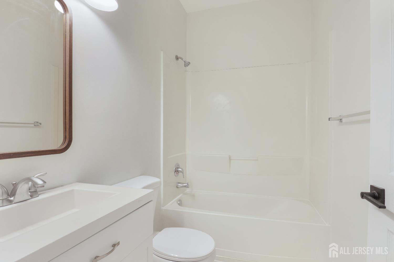 130B Remsen Avenue, Unit B New Brunswick, NJ 08901 - Photo 11 of 29 a bathroom with a sink toilet and shower
