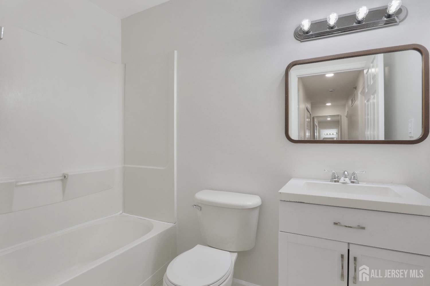 130B Remsen Avenue, Unit B New Brunswick, NJ 08901 - Photo 17 of 29 a bathroom with a toilet sink and bathtub