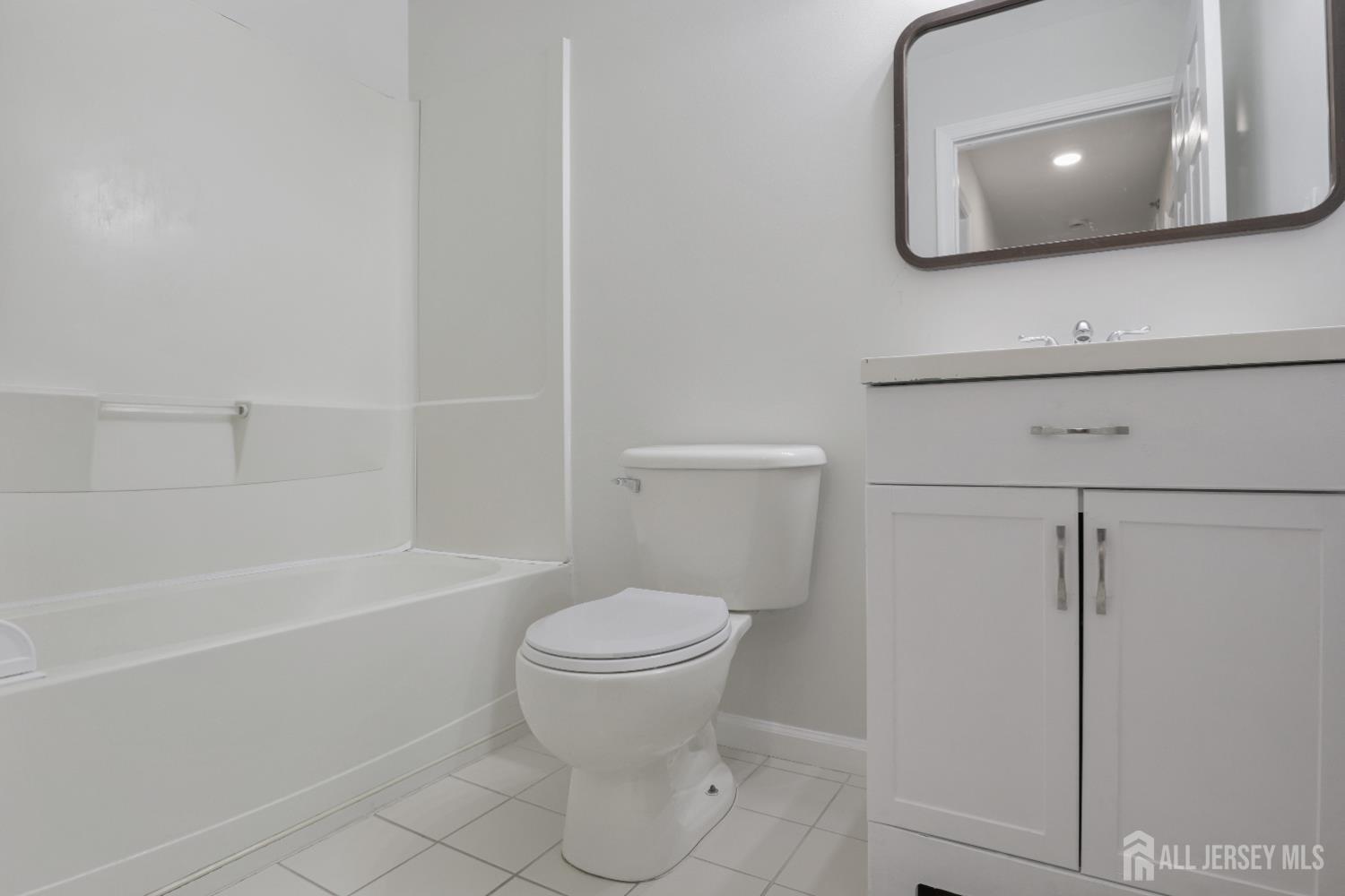 130B Remsen Avenue, Unit B New Brunswick, NJ 08901 - Photo 18 of 29 a bathroom with a toilet a sink and bathtub