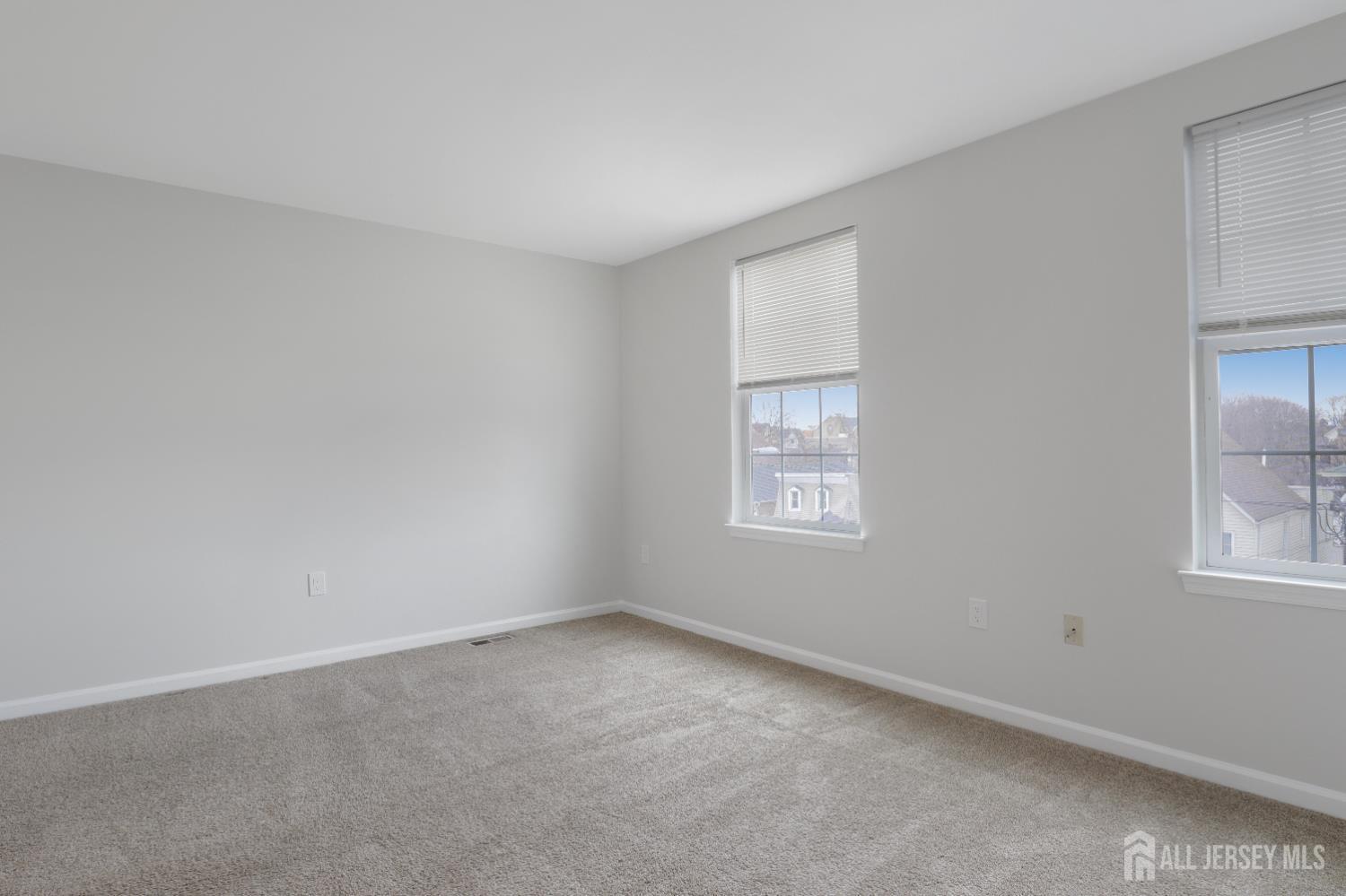 130B Remsen Avenue, Unit B New Brunswick, NJ 08901 - Photo 24 of 29 an empty room with windows