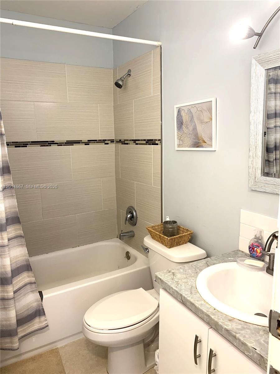 4904 Southwest 139th Court Miami, FL 33175 - Photo 13 of 20 a bathroom with a sink and a mirror