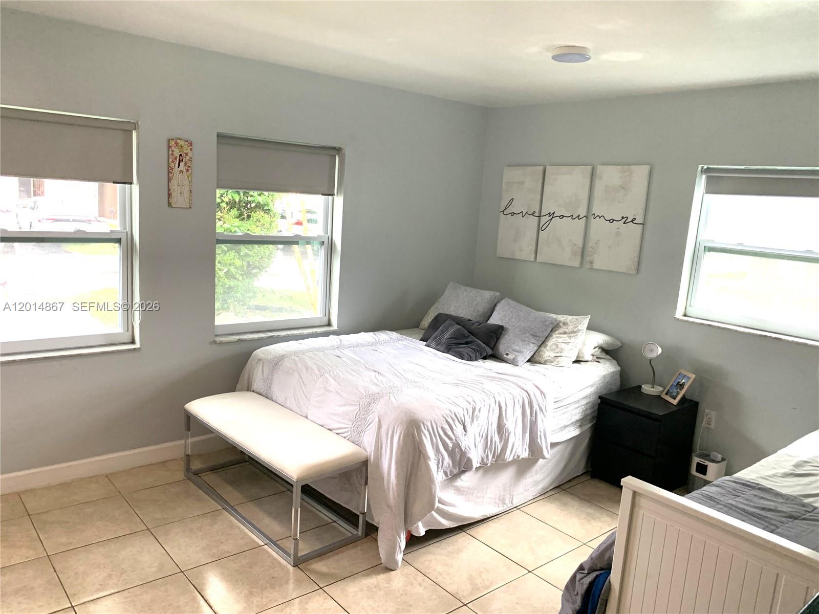 4904 Southwest 139th Court Miami, FL 33175 - Photo 15 of 20 a bedroom with a bed and a window