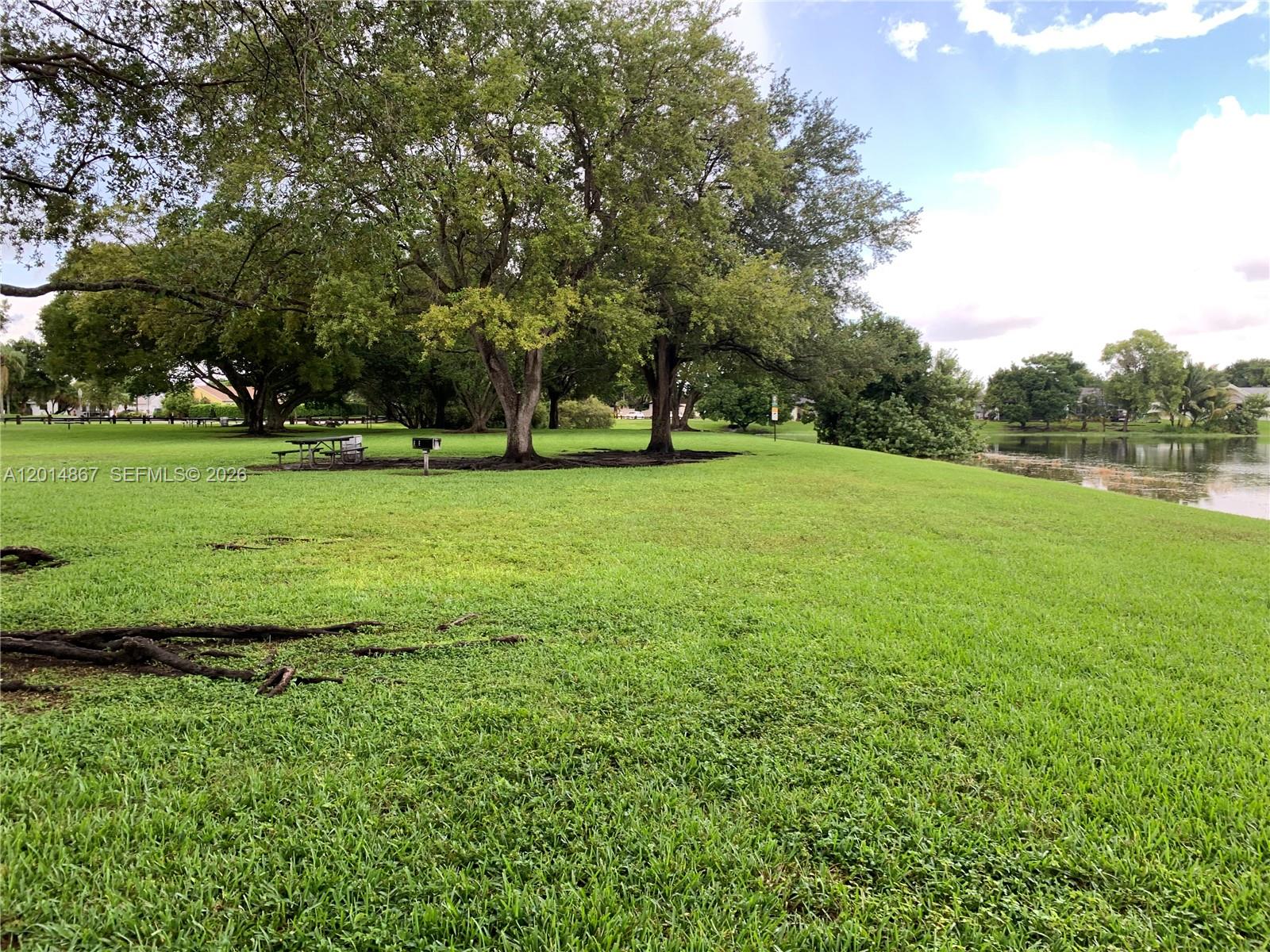 4904 Southwest 139th Court Miami, FL 33175 - Photo 20 of 20 a view of a field with trees in the background