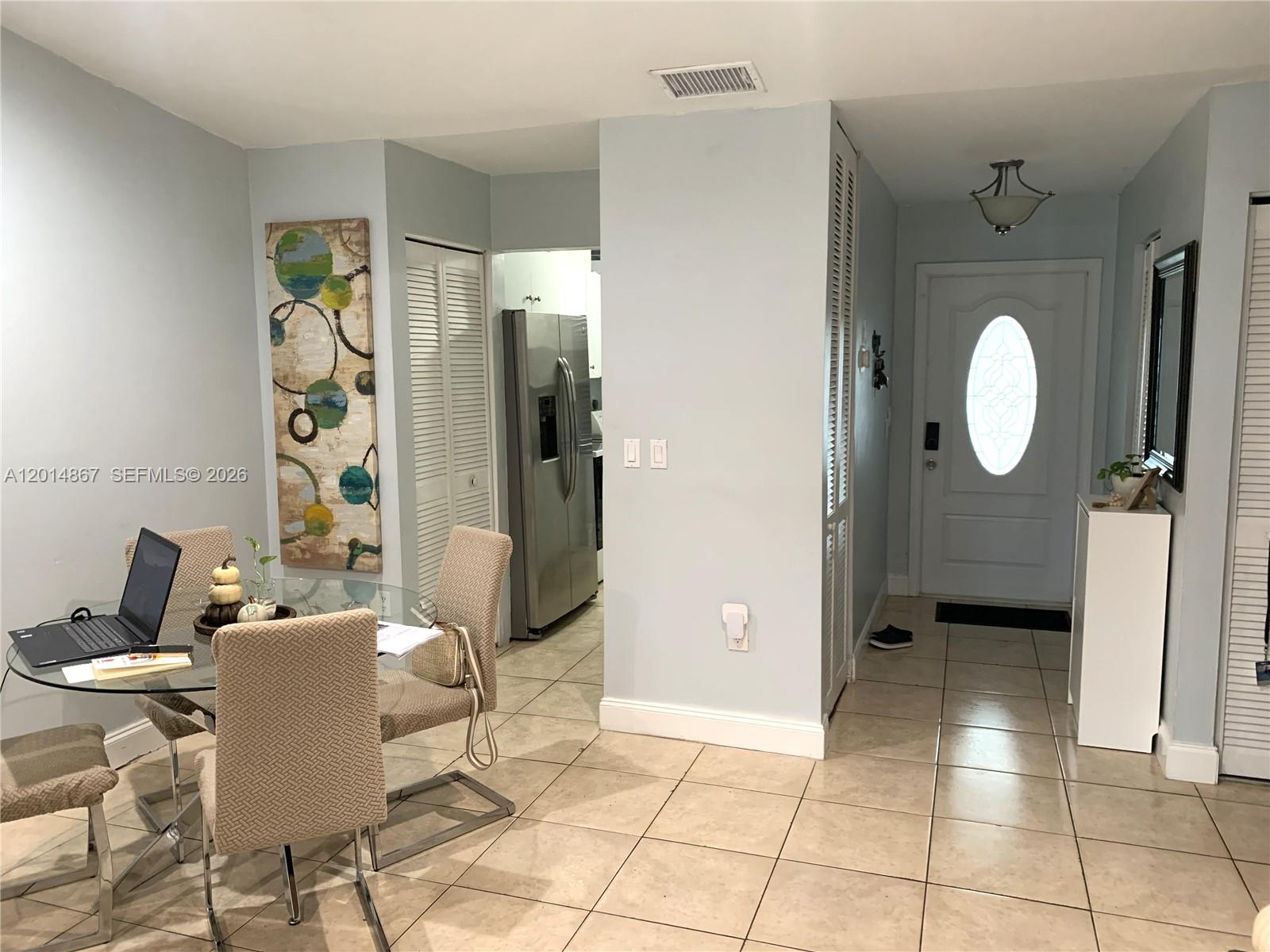 4904 Southwest 139th Court Miami, FL 33175 - Photo 5 of 20 a view of a dining room with furniture and a mirror