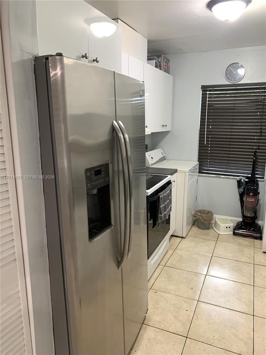 4904 Southwest 139th Court Miami, FL 33175 - Photo 7 of 20 a kitchen with stainless steel appliances granite countertop a refrigerator and a stove